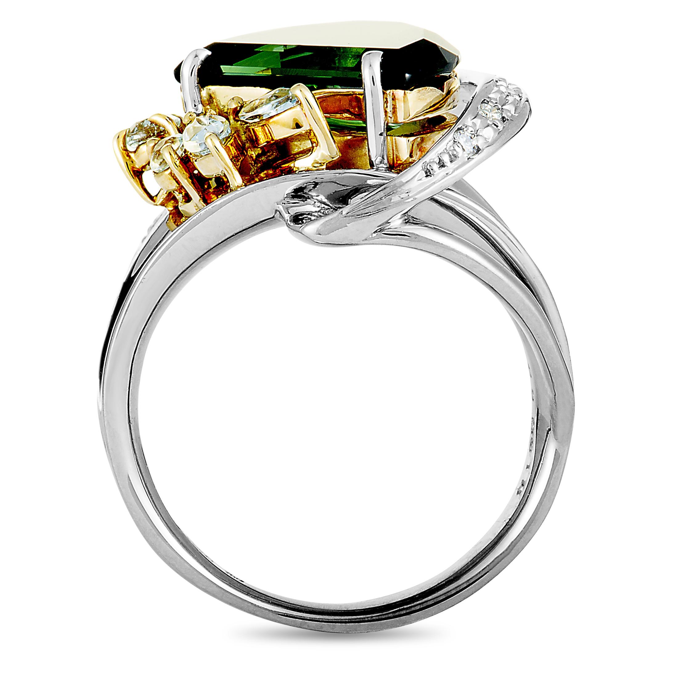 Fashionably crafted from the prestigious glisten of platinum and shimmering 18K yellow gold, this stunning ring is an artistic wonder! The beautiful is embellished with 0.18 carats of gorgeous diamonds and a sensational green tourmaline, weighing