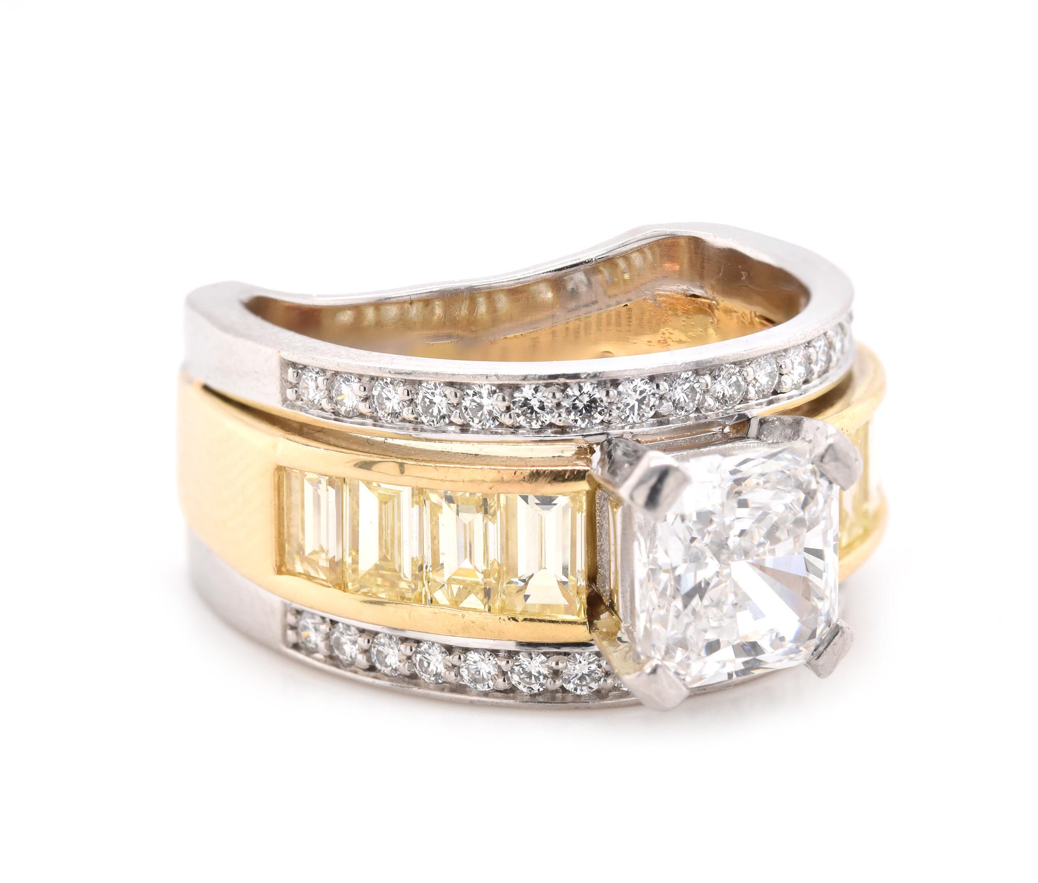 Material: Platinum & 18K Yellow Gold
Center Diamond: 1 radiant cut = 2.01ct
Color: G
Clarity: SI1
GIA: 15003096
Diamond: 8 emerald cut = 1.00cttw
Color: Fancy Light Yellow
Clarity: SI1
Diamonds: 34 round cut = .51cttw
Color: G
Clarity: VS2
Ring