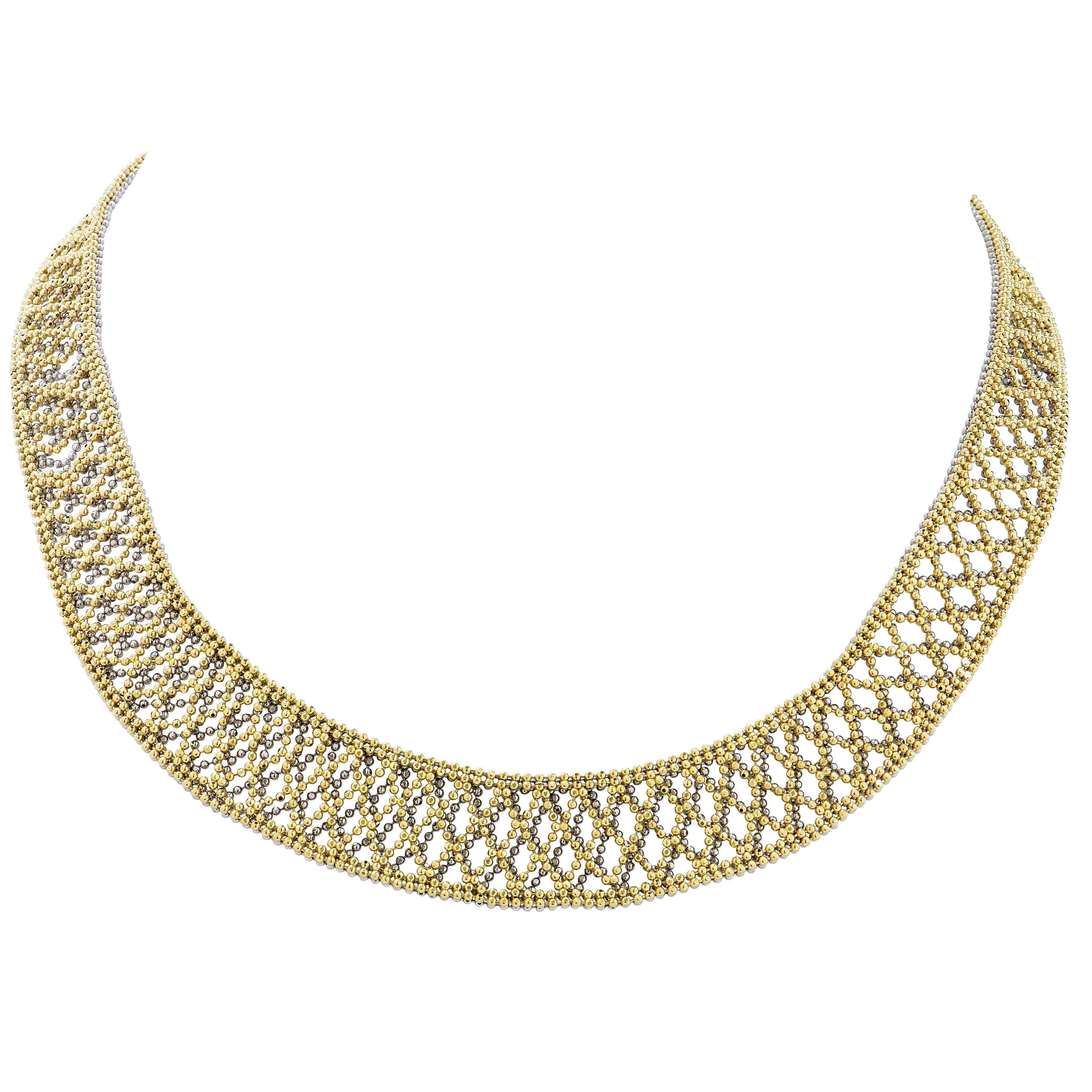 This beautifully crafted bead work open lattice necklace features two layers of beads giving the necklace depth the mixture of white and yellow beads.
Necklace Length: 15 Inches
Metal Type: Platinum and 18 Karat Yellow Gold
Metal Weight: 34.6 Grams