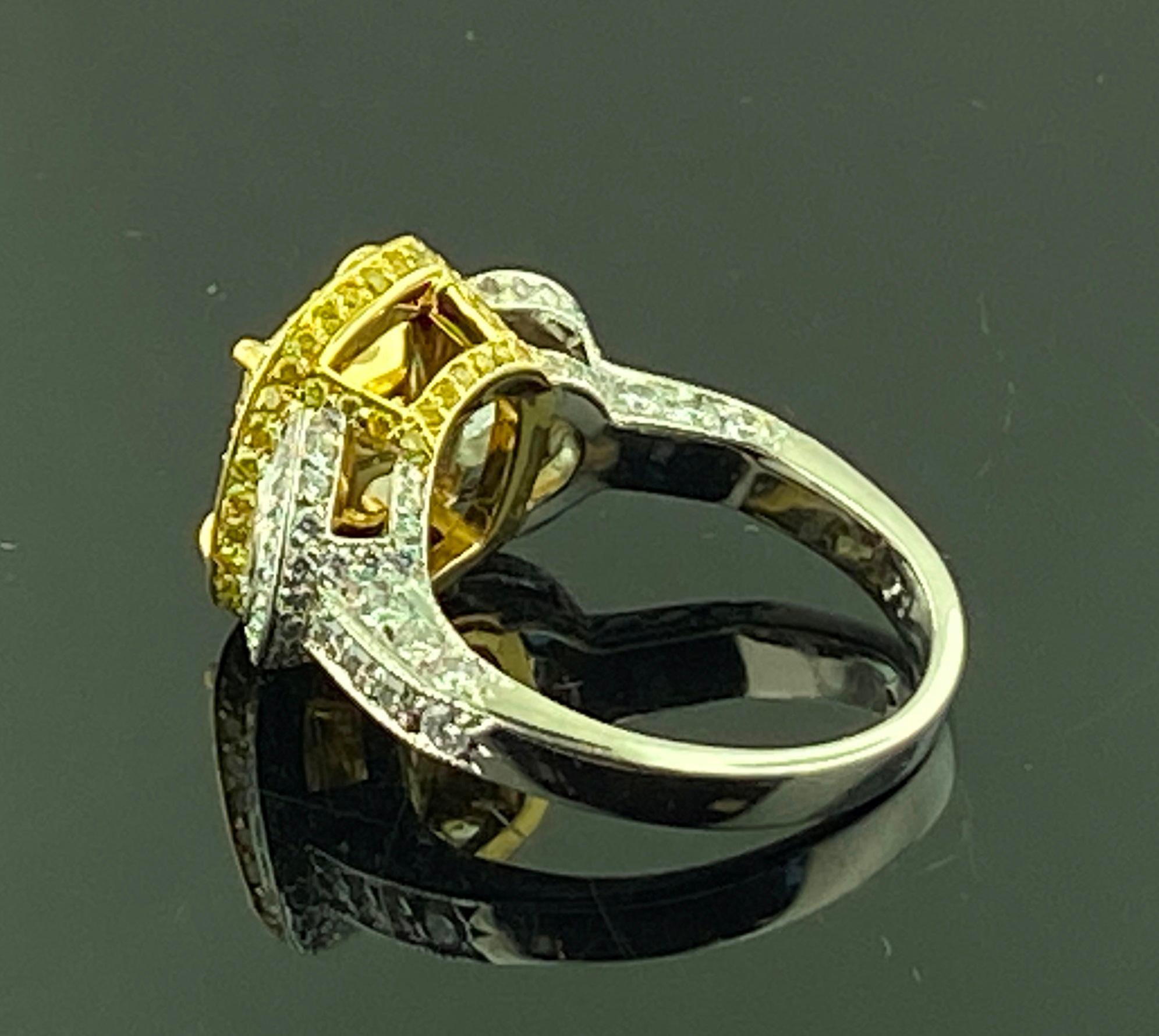 Platinum and 18 KT Yellow Gold 3.74 Ct Radiant Cut Fancy Yellow Diamond Ring In Excellent Condition For Sale In Palm Desert, CA