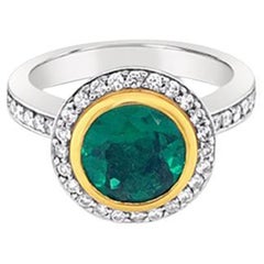 Platinum and 18ct Yellow Gold Emerald and Diamond 
grace
 Ring