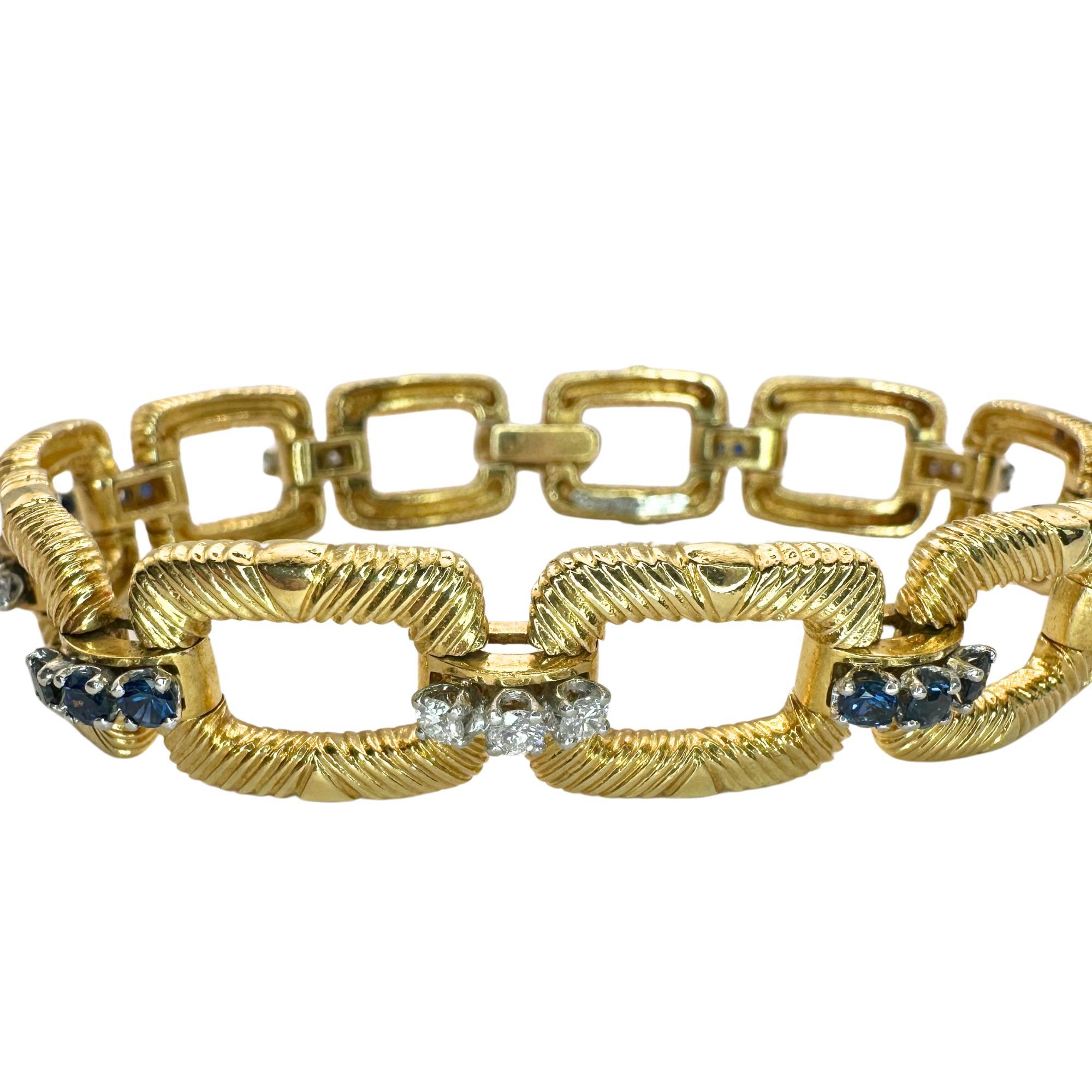Indulge in luxury and timeless elegance with this exquisite Platinum and 18k Cartier Diamond and Sapphire Bracelet. Featuring approximately 0.75 carats of sparkling diamonds and sapphires, this 1960's piece is marked with 