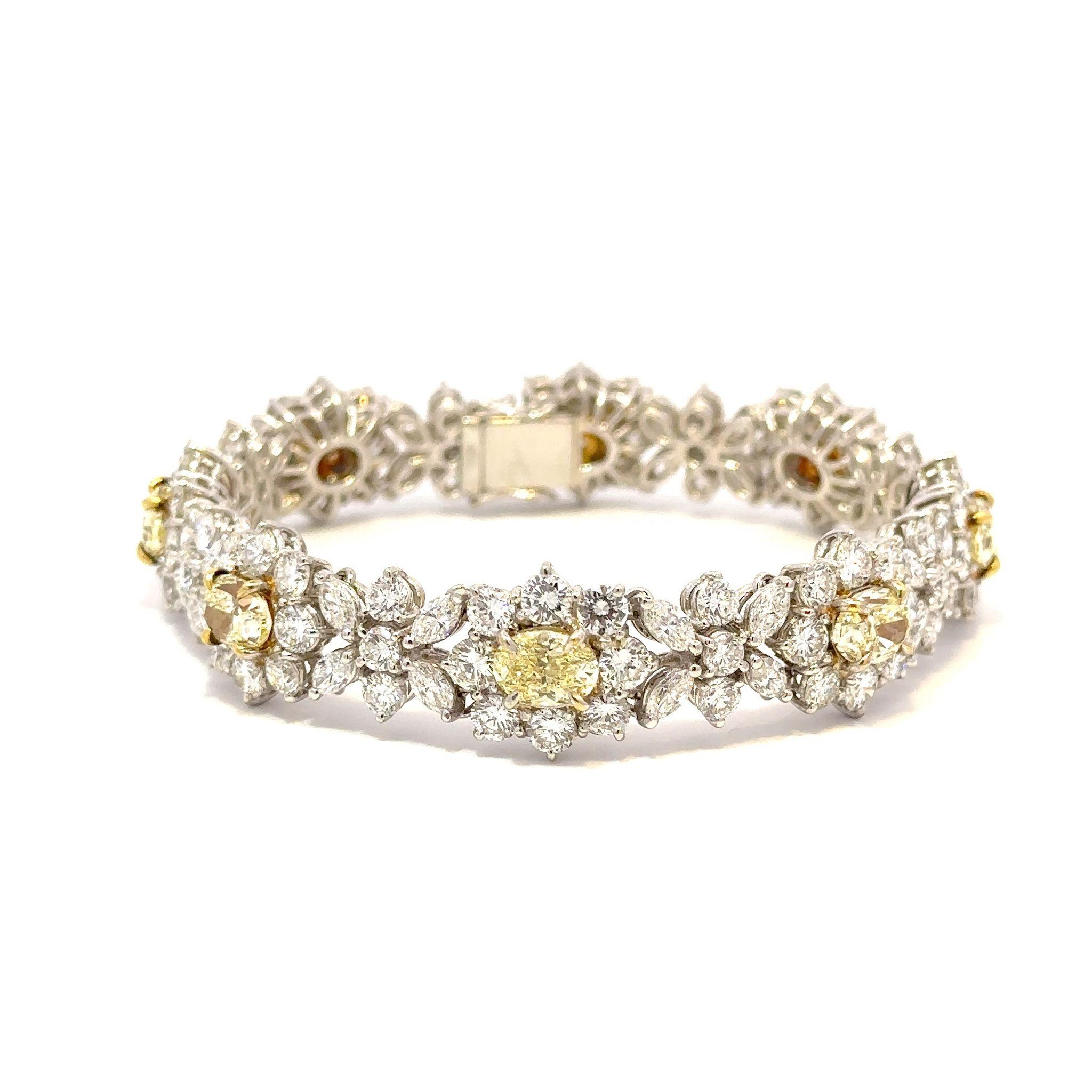Bracelet composed of platinum featuring yellow and white diamonds. There are approximately 16.50 carats of round and marquise shaped white diamonds and 8.39 carats of oval shaped yellow diamonds.  All eight of the yellow diamonds are accompanied by