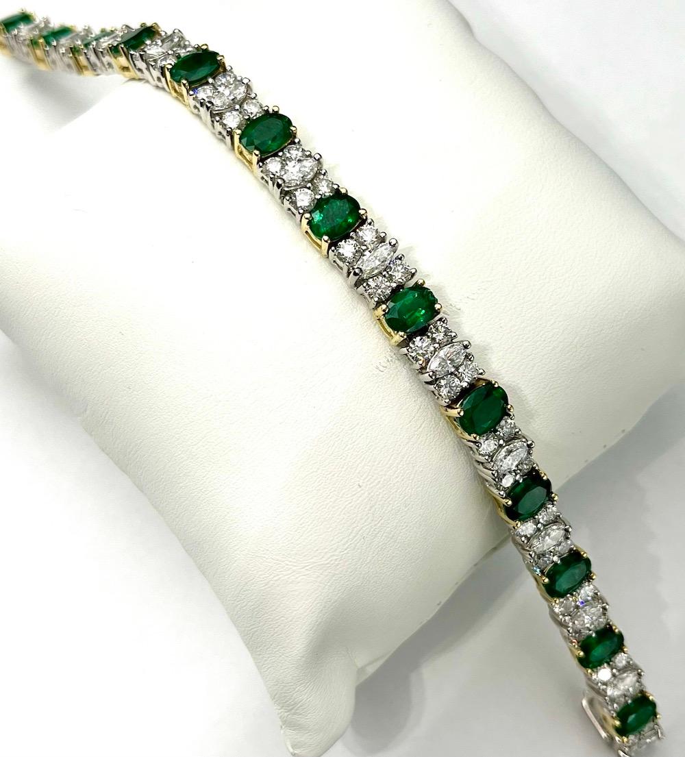 This absolutely beautiful bracelet is comprised of 13 Natural Oval Emeralds of 9.13Ct Total Weight, 13 Natural White Marquise Diamonds of 2.42Ct Total Weight, and 52 Natural Round White Diamonds of 5.27Ct Total Weight. The links are wonderfully