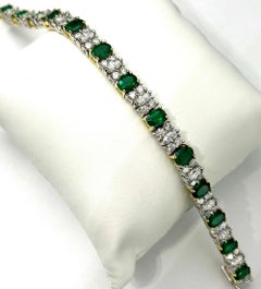 Platinum and 18K Gold Oval Emeralds and Diamonds Bracelet