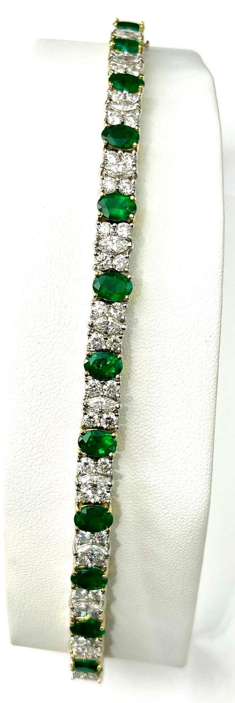 Oval Cut Platinum and 18K Gold Oval Emeralds and Diamonds Bracelet For Sale