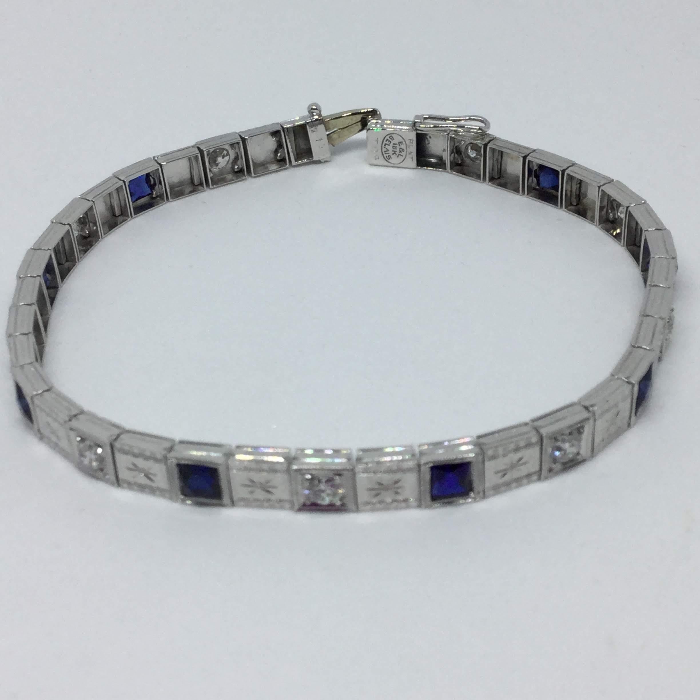 Platinum and 18K white gold sapphire and diamond bracelet.  The bracelet contains 8 square faceted cut sapphires. The sapphires weigh approx 1.25 ctw. The bracelet also contains 9 round brilliant cut diamonds. The diamonds weigh approx 0.90 ctw. The