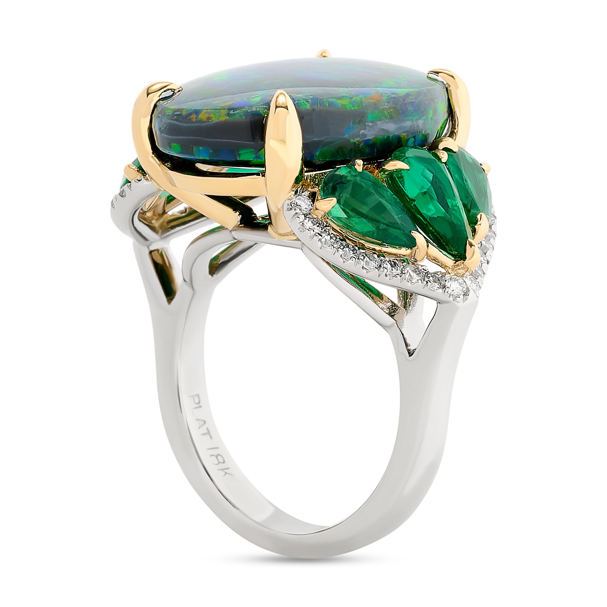 Nestled amidst vibrant green emeralds, the black opal ring exuded an enchanting allure.

The center black opal weighs approximately 9.50 carats and is accompanied with a GIA Black, No Treatment certificate. There are 6 pear shaped emeralds that