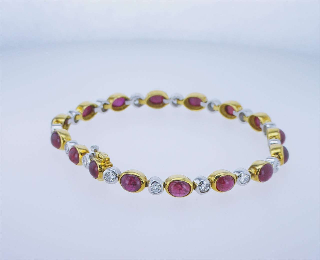 Ruby Cabochon Bracelet set in 18k Yellow Gold and Platinum TT, featuring 12.92ct of Cabochon Rubies and 1.60ct TW of Round Brilliant Diamonds. Stock length.