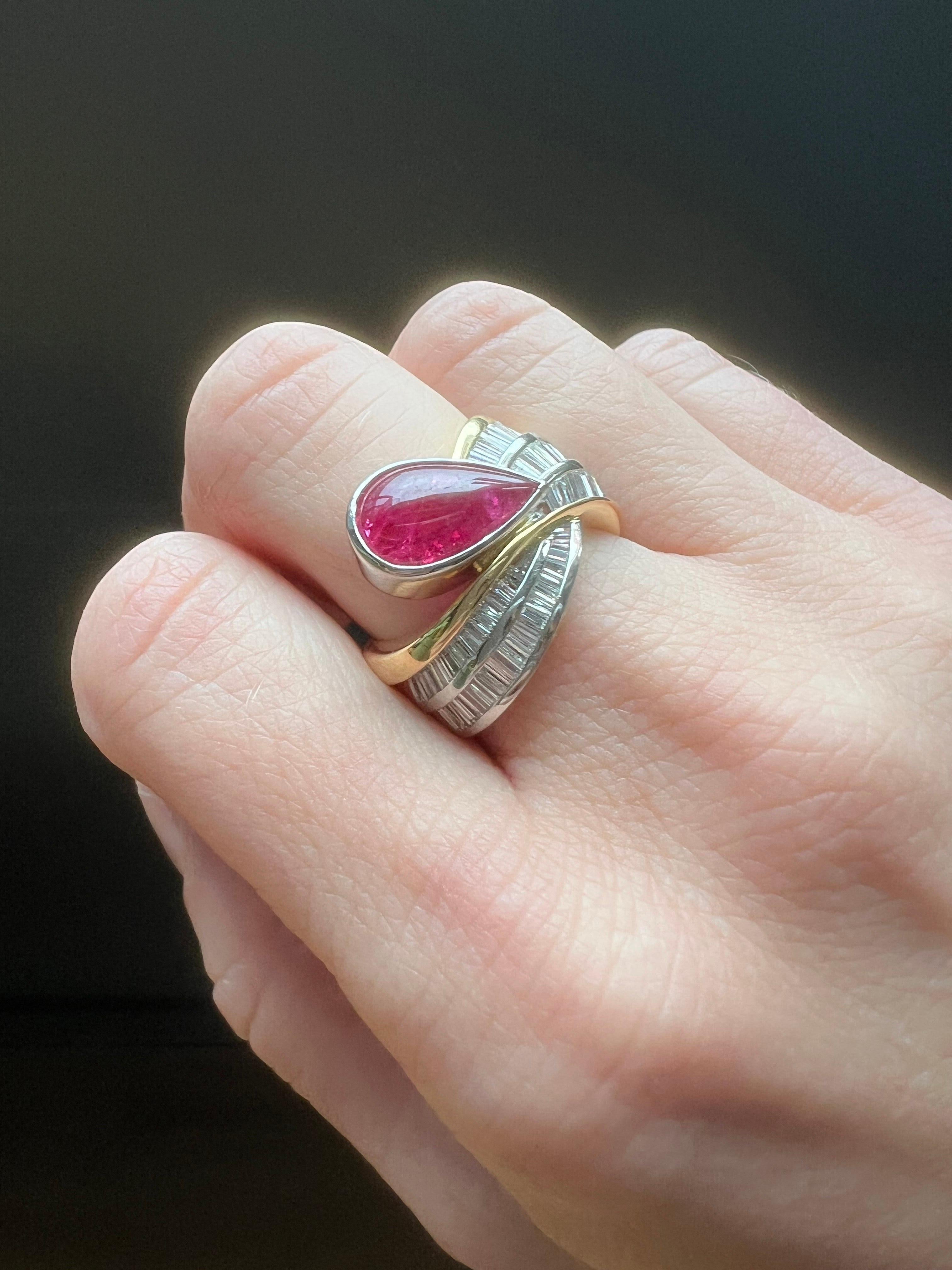 Platinum and 18kt Gold Ruby & Diamond Ring.
WGI certified. 

Details:
Maker: Unknown
Year: 1990s
Material: Platinum and 18kt yellow gold
Weight: 14.6 grams

Ring Size:
UK: M
US: 6 1/2
EU: 52 1/2

Gemstone Details:
Diamond:
Quantity: 28 baguette-cut