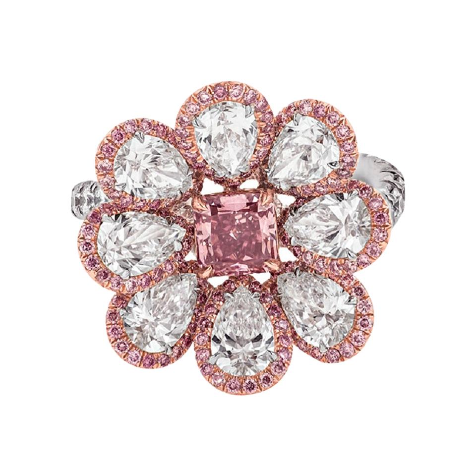 Platinum and 18kt pink gold pink diamond ring with center gia certified .80 vp-si2 ( radc 921) set with 8 white pear shape diamonds 4.05ct and surrounded by micropave pink diamonds .70ct.
