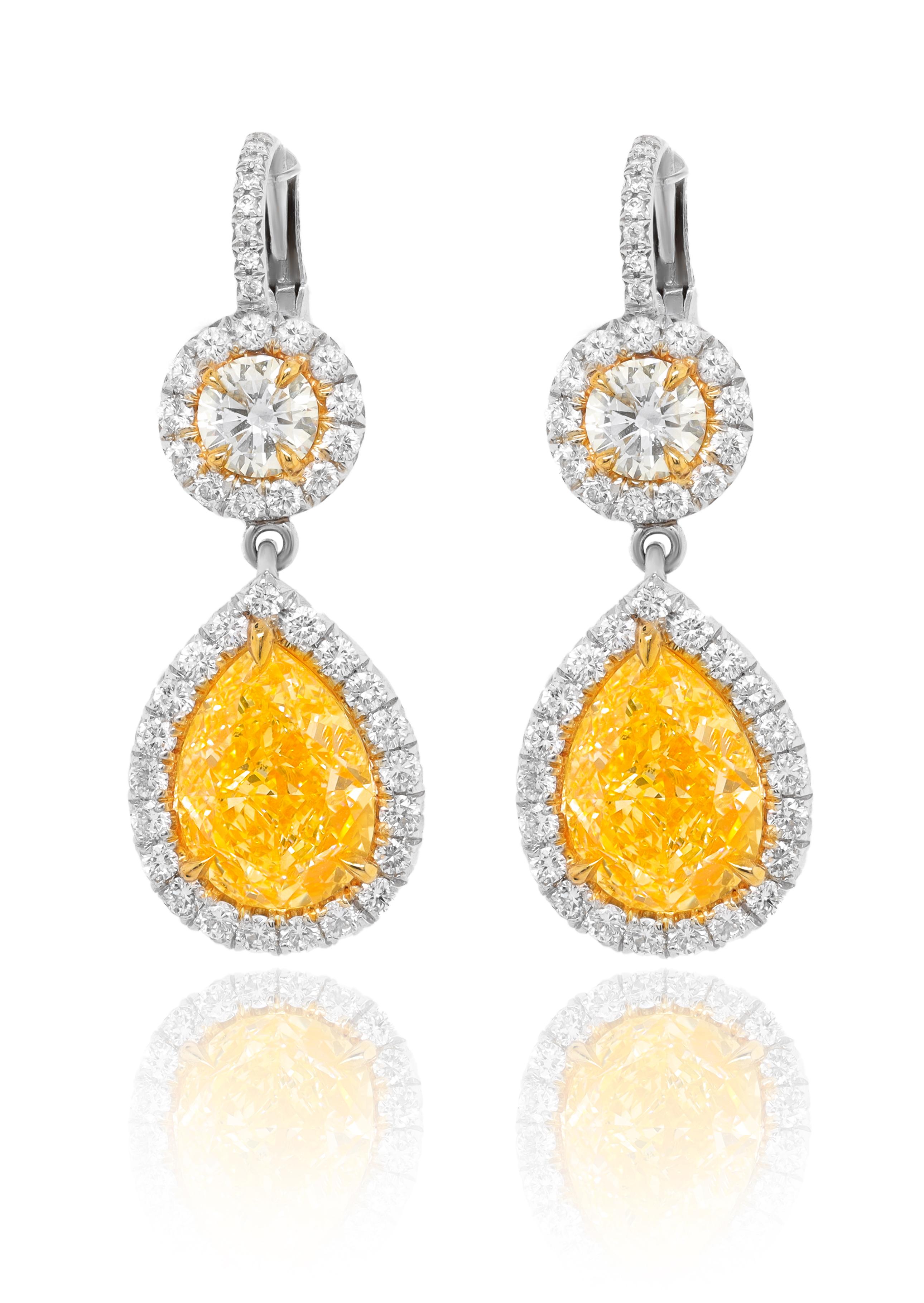 Platinum and 18kt yellow gold fancy yellow diamond earrings, gia certified features 4.54ct of two pear shaped diamonds fy vs-vs1 and 1.70ct micropave rd diamonds all around. (psc289 & psc290)
