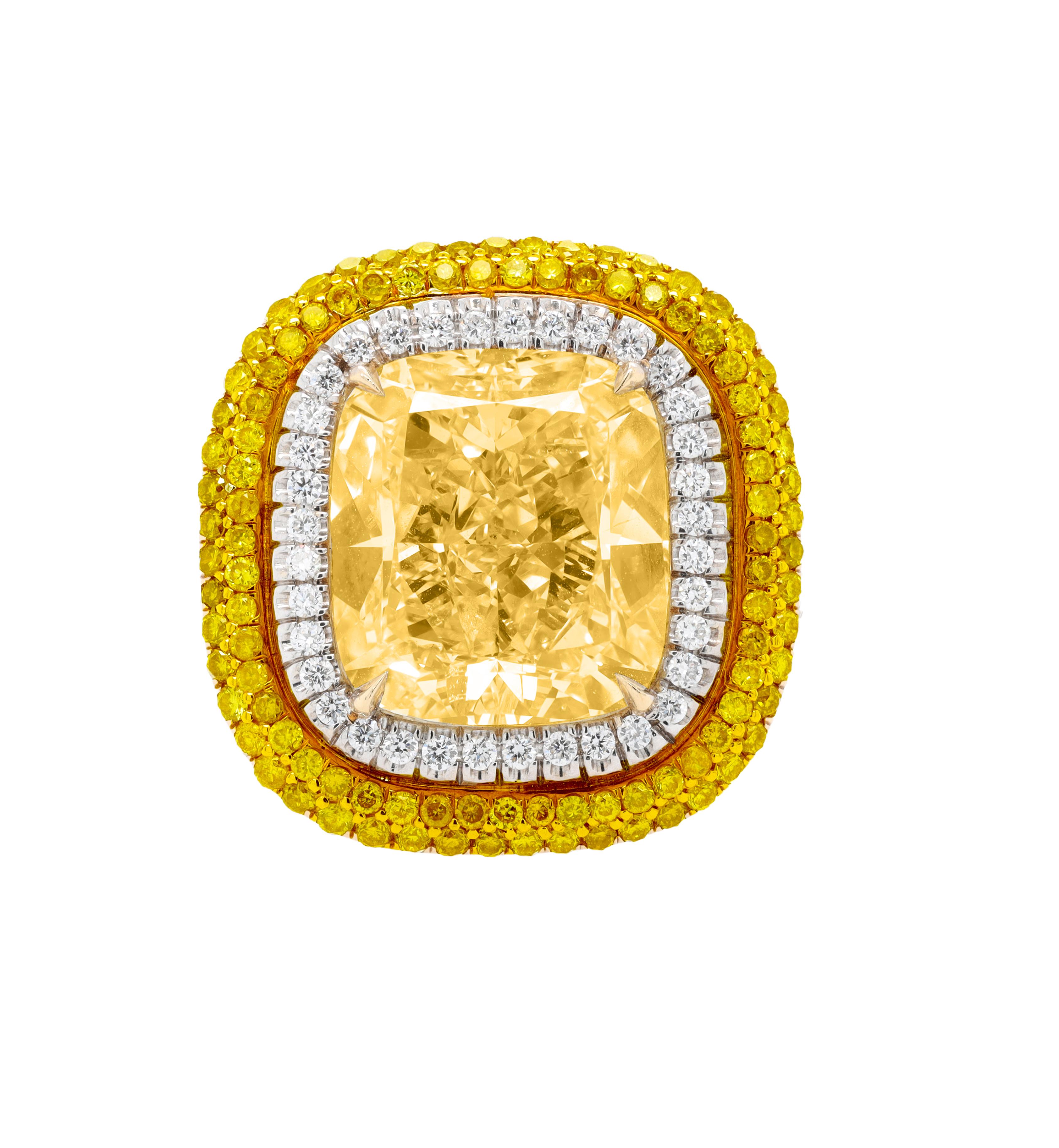 Platinum and 18kt yellow gold diamond engagement ring with GIA certified fancy yellow center cushion cut diamond 8.56 fysi1 (radc901) set in double halo setting with 1.51ct of micropave yellow and white round diamonds.
