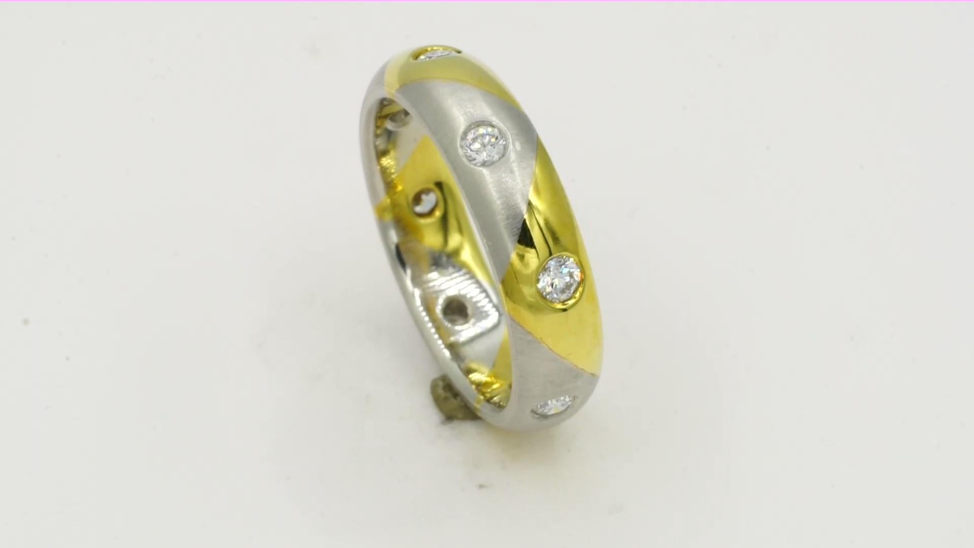  NEW Platinum and 18kt yellow gold flush set round brilliant diamond eternity band of 5 mm wide. Size 6 1/2. The band has alternating sections of polished 18kt yellow gold and satin finish platinum with eight round brilliant diamonds of .44cttw,