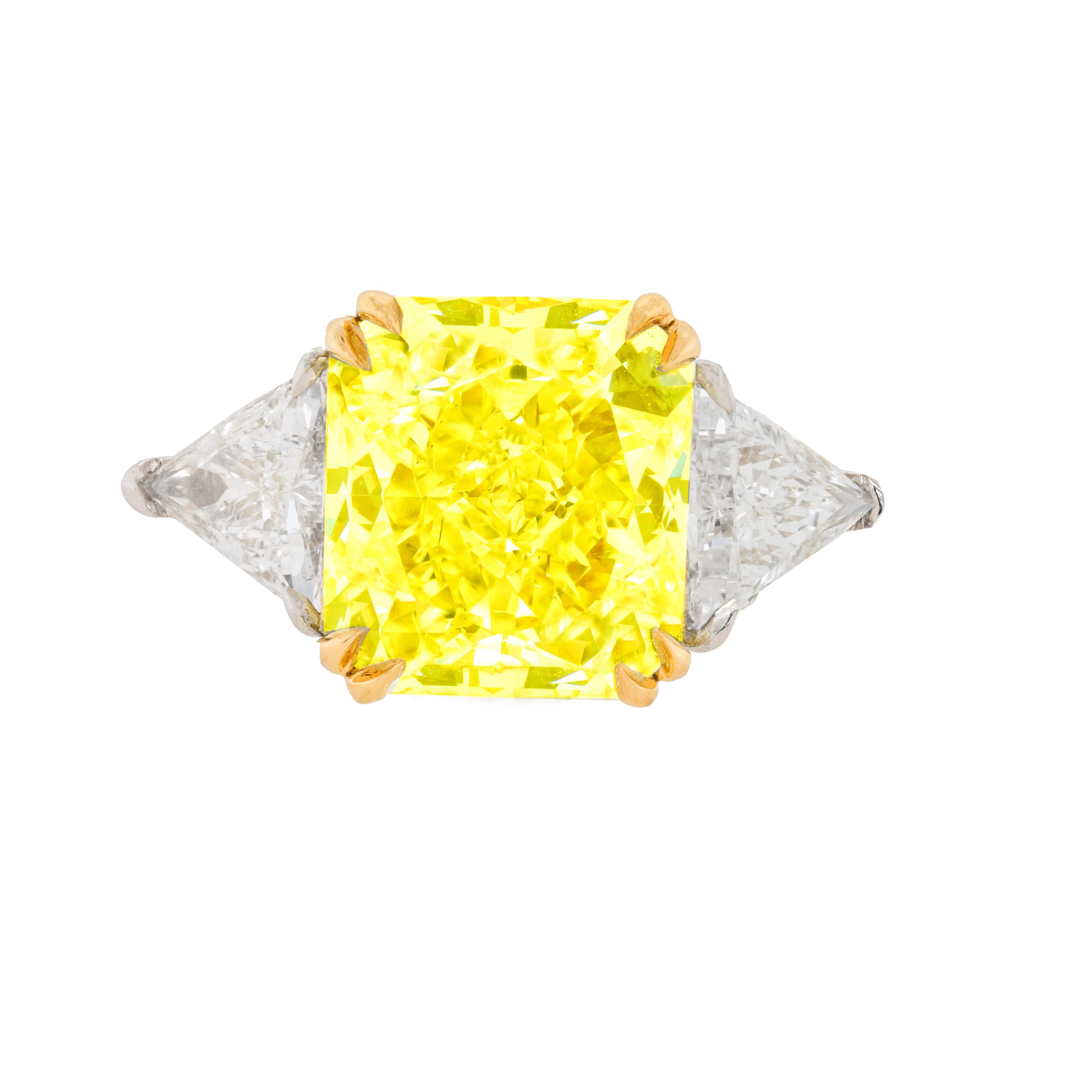 Platinum and 18kt yellow gold custom made ring with center diamond 5.96cts natural fancy yellow vs1 GIA certified #14467201 and 1.06cts of trillion set
