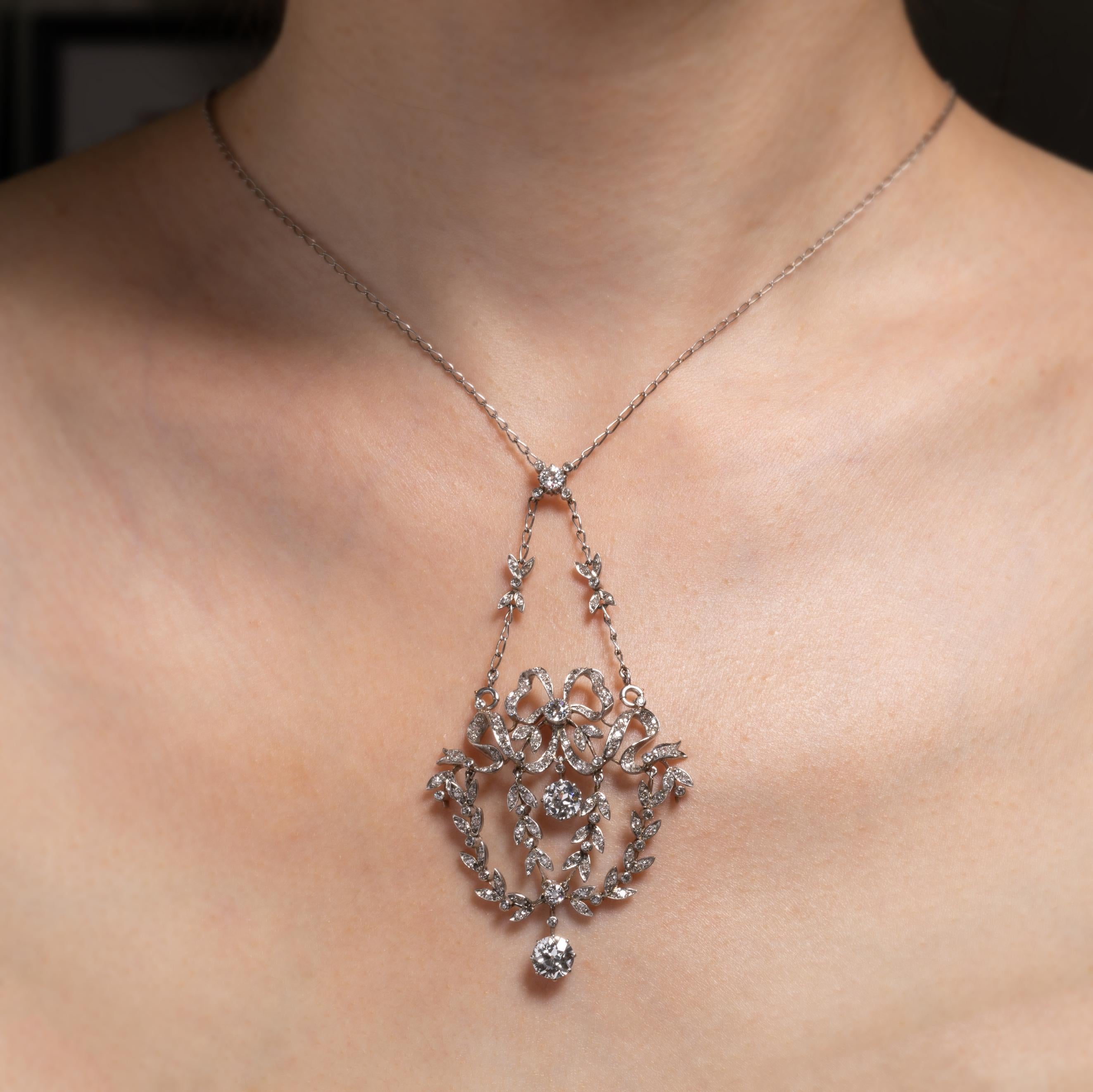 Very beautiful antique necklace, made in France circa 1910.

Made in Platinum and diamonds.

The two principal diamonds are good quality, round old European cut. They are very white in colour (F/G) and clear. They weight 1 carat for one and 0.75 for