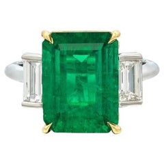 Platinum and 4.93ct Emerald Cut Colombian Emerald and Diamond Three Stone Ring