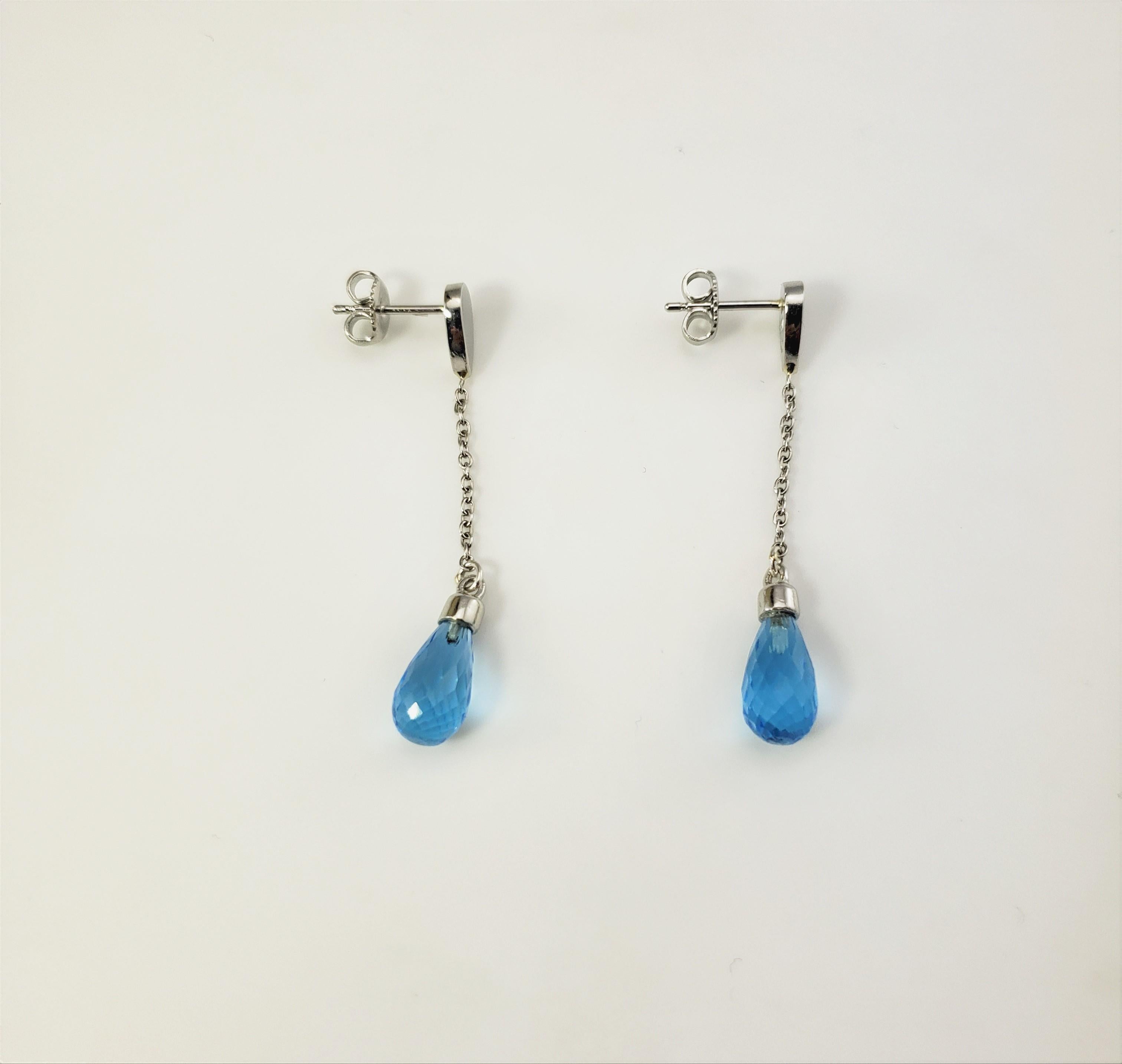 Pear Cut Platinum and Genuine Blue Topaz Dangle Earrings For Sale