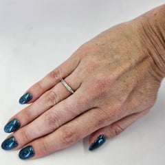 Platinum and Channel Set Round Diamond Ring