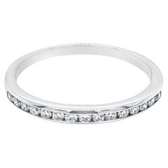 Platinum and Channel Set Round Diamond Ring