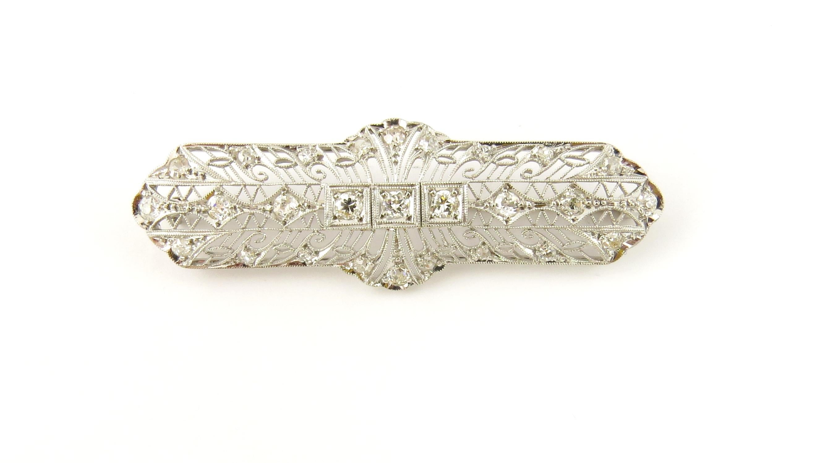 Vintage Platinum and Diamond Bar Pin/Brooch

This exquisite brooch features three round brilliant cut diamonds in its center (.08 ct. each), 12 old mine cut diamonds (.04 ct. each) and 12 single cut diamonds (.01 ct. each) set in beautifully