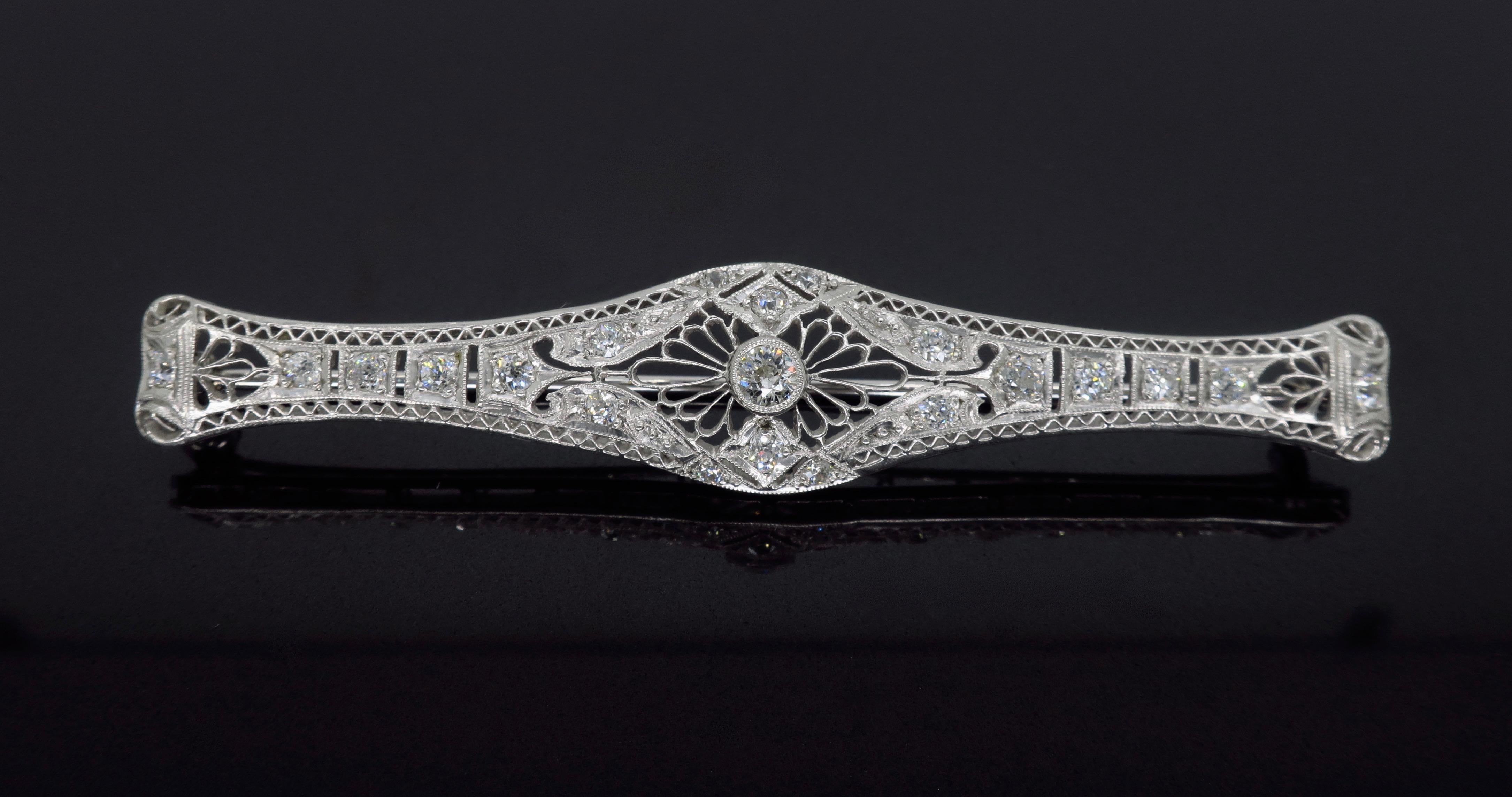 Vintage diamond bar brooch crafted in platinum.

Diamond Carat Weight: Approximately .59CTW
Diamond Cut: Old European Cut Diamonds
Color: Average G-J
Clarity: Average VS-SI
Metal: Platinum
Marked/Tested: Tested Platinum
Weight: 8.1 Grams
Length: