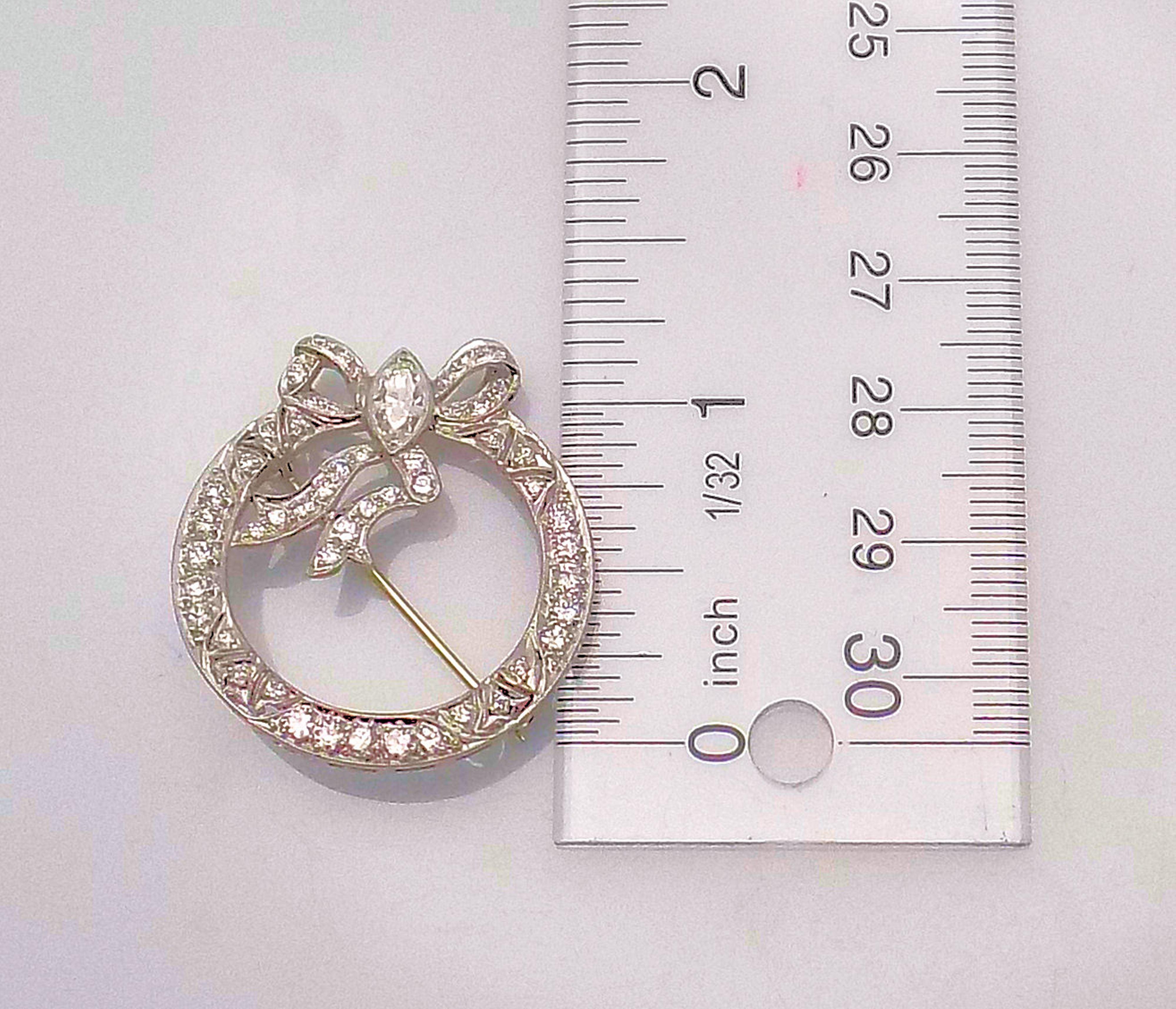 Marquise Cut Platinum and Diamond Bow Brooch For Sale