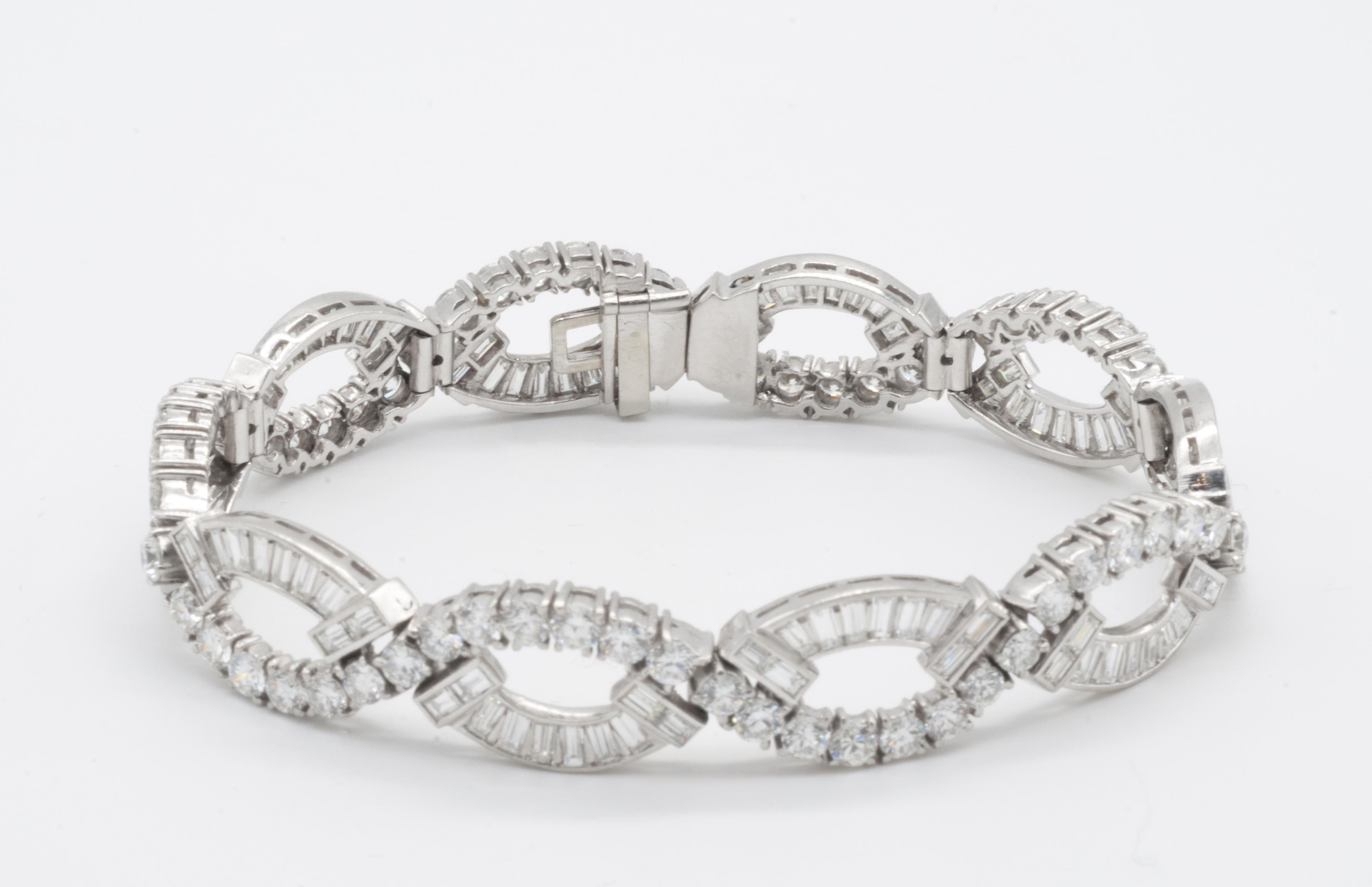 One lady's platinum diamond bracelet. The bracelet contains 70 round brilliant cut diamonds with a total weight of 6.3ct and 60 straight baguette diamond's with a total weight of 5.6cts. The diamonds are color F and VS1. 