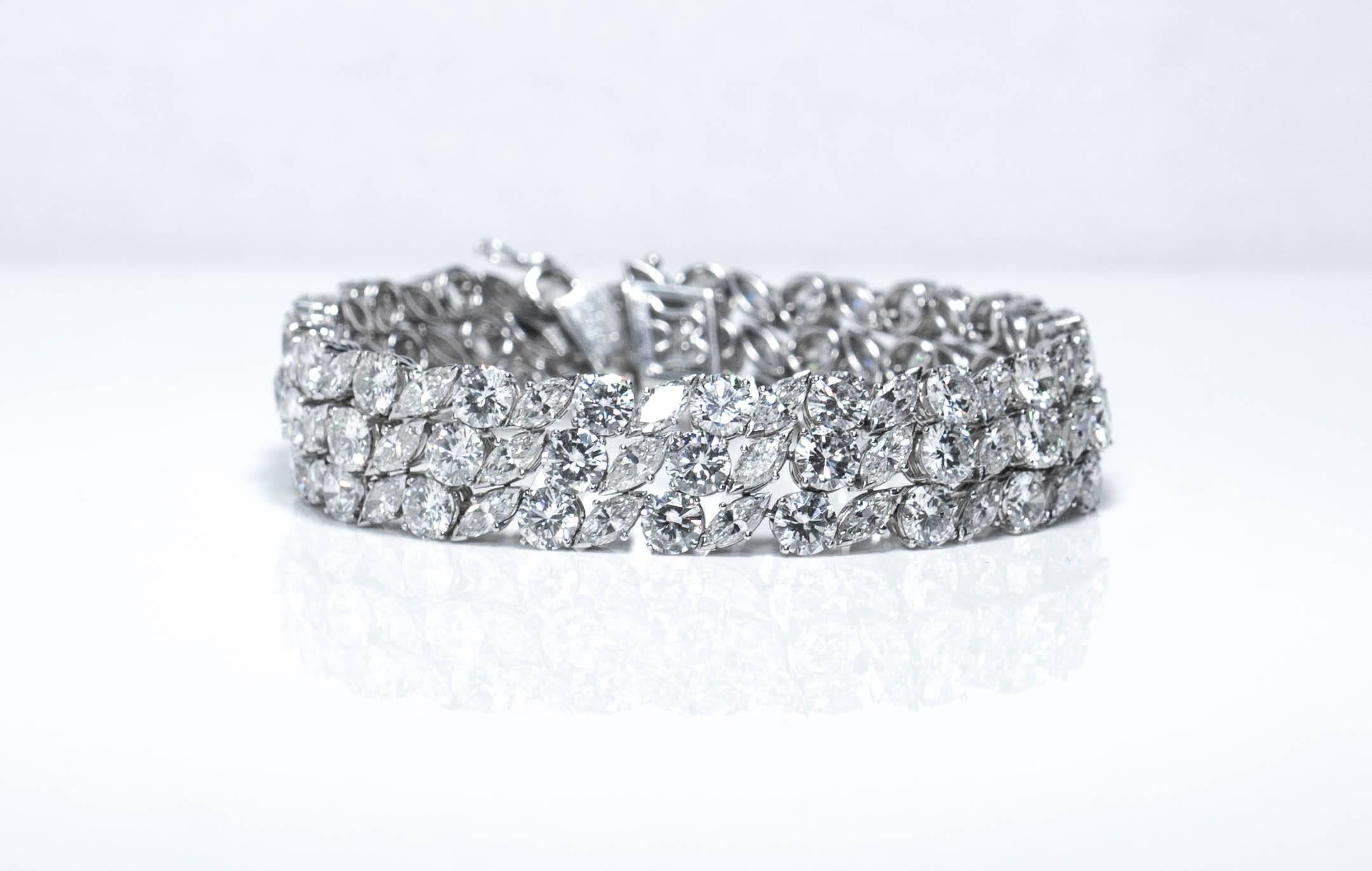 Platinum and diamond bracelet containing 114 Diamonds weighing 30 carats total. 
57 Round brilliants, and 57 Marquise brilliants. 
Handmade clasp design ,beautifully hides the closure.

