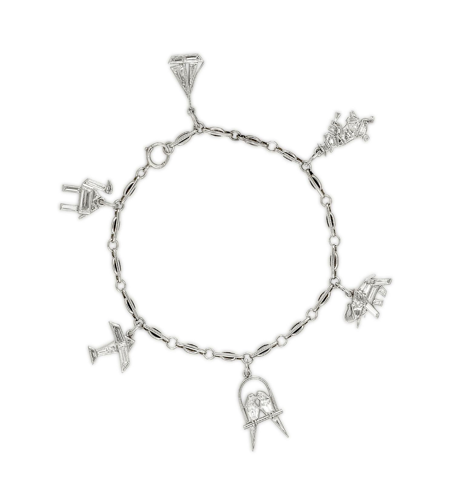 Diamond and Platinum Charm Bracelet; Boucheron, Paris; Ca1925
Consisting of a Pair of Love Birds; A Sailboat; An Elephant; An Airplane; A Camel and a Little Piggy Playing a Flute.