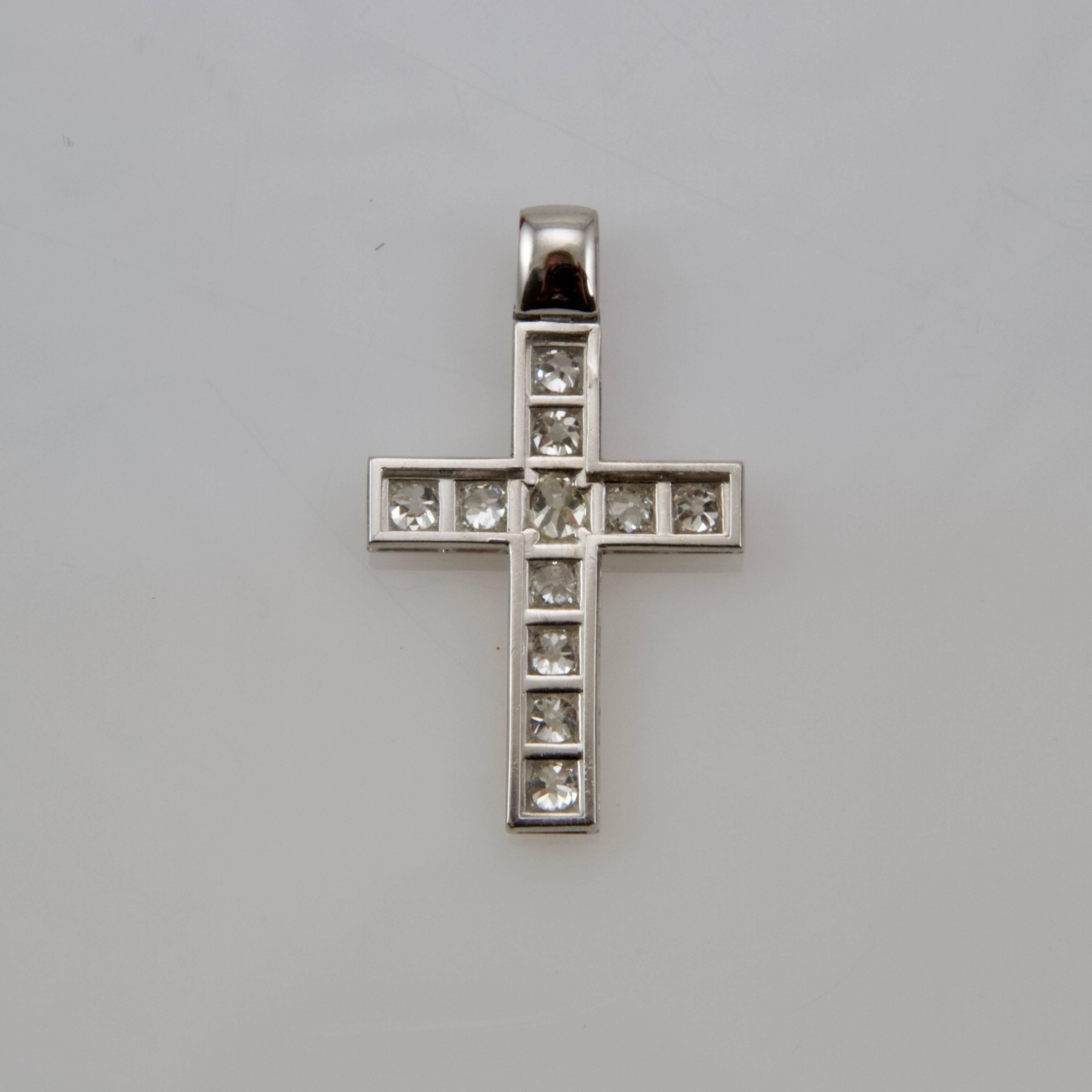 Simple platinum cross set with 11 antique cut diamonds. 
Weight of stones almost 2.20 carats
Weight: 6.52gr