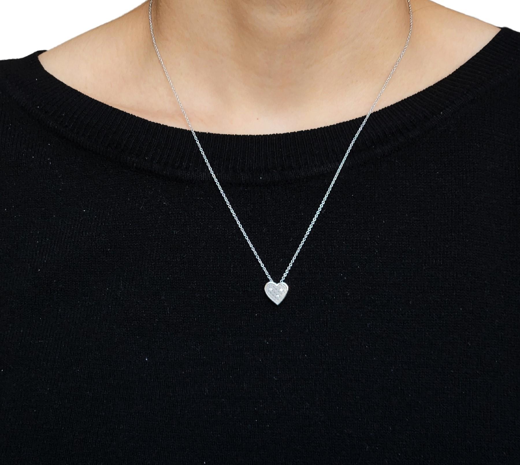 Continuing with the unique mini pyramid matte pattern with interspersed white diamonds and platinum, the Heart slide can be an everyday necklace. The border is high polished to contrast with the matte finish and the diamonds give a surprise sparkle
