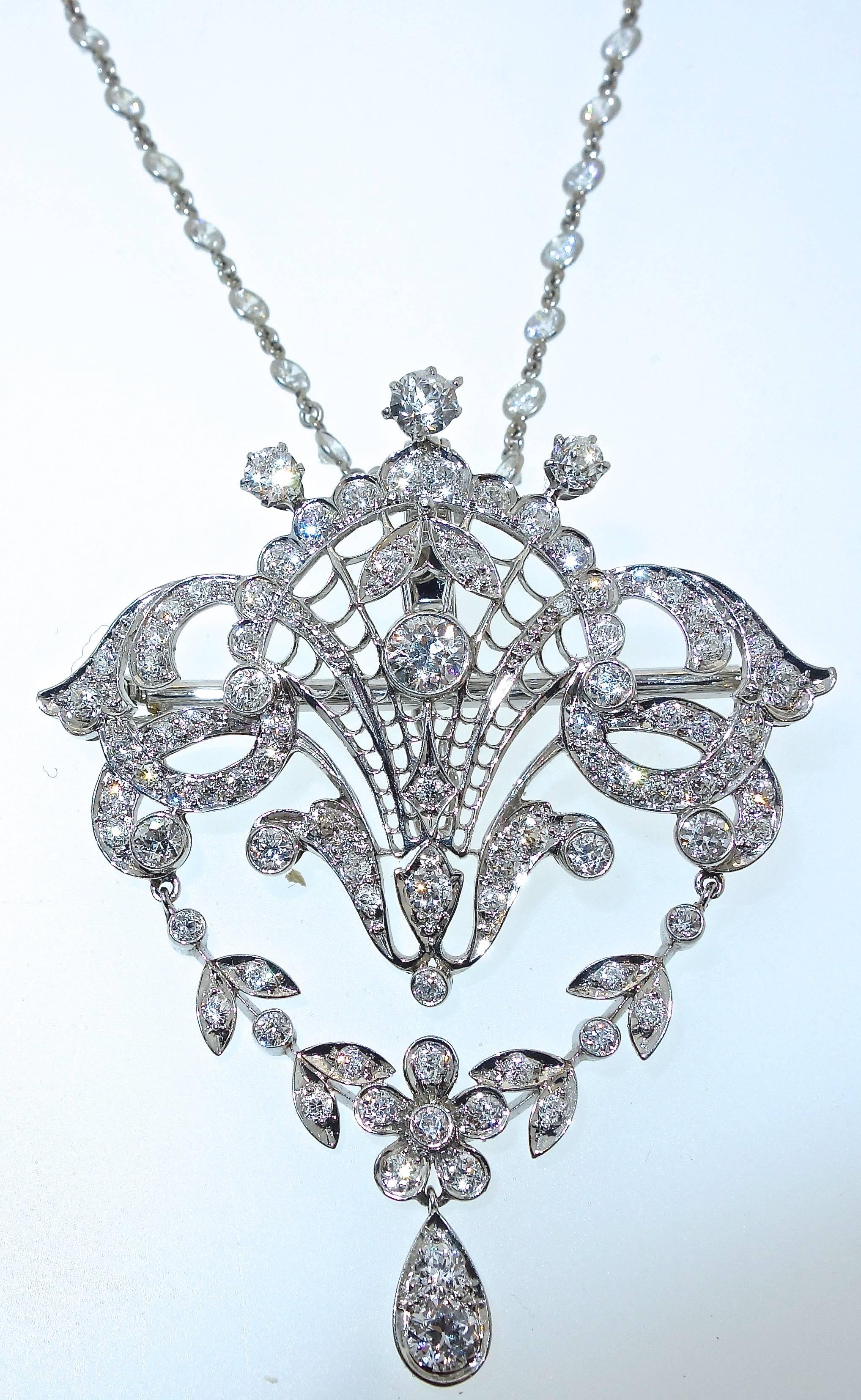 The diamonds are a bright white and very slightly included.  This pendant has a classic garland motif - graceful and delicate yet unusual and stunning.  It is both a pendant and a necklace.  It suspends from a modern diamond necklace which has 5