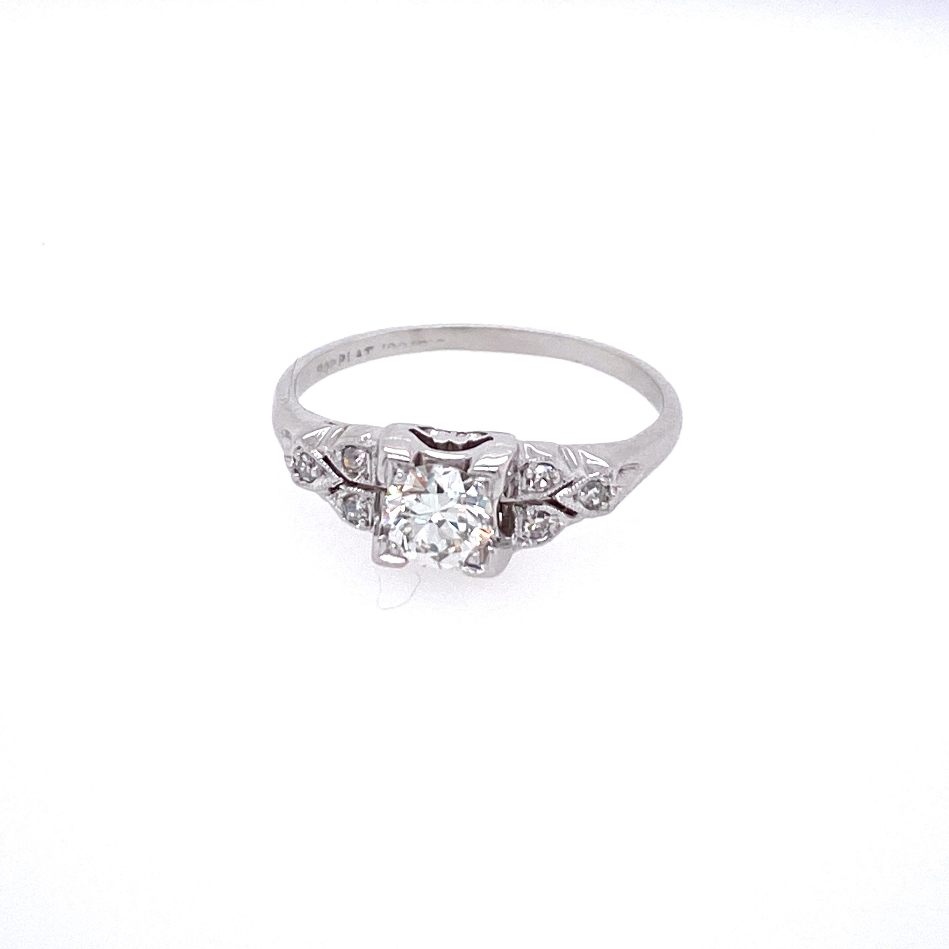One platinum (stamped 900PT-4T) Retro diamond engagement ring featuring one 0.38 carat Old European cut center diamond with H/I color and SI1/SI2 clarity and six single cut diamonds approximately 0.12 carat total weight with matching H/I color and