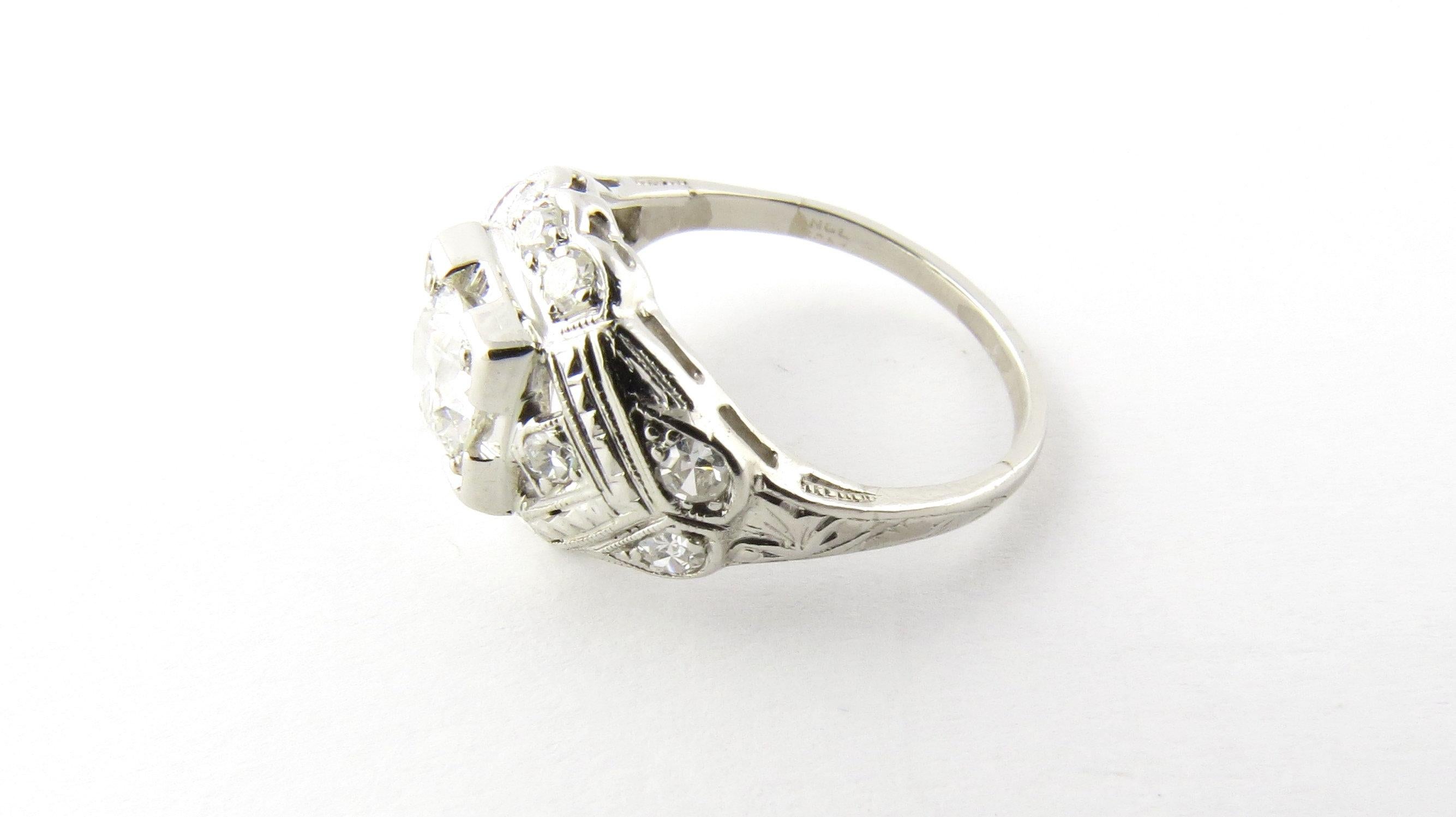 Round Cut Platinum and Diamond Engagement Ring