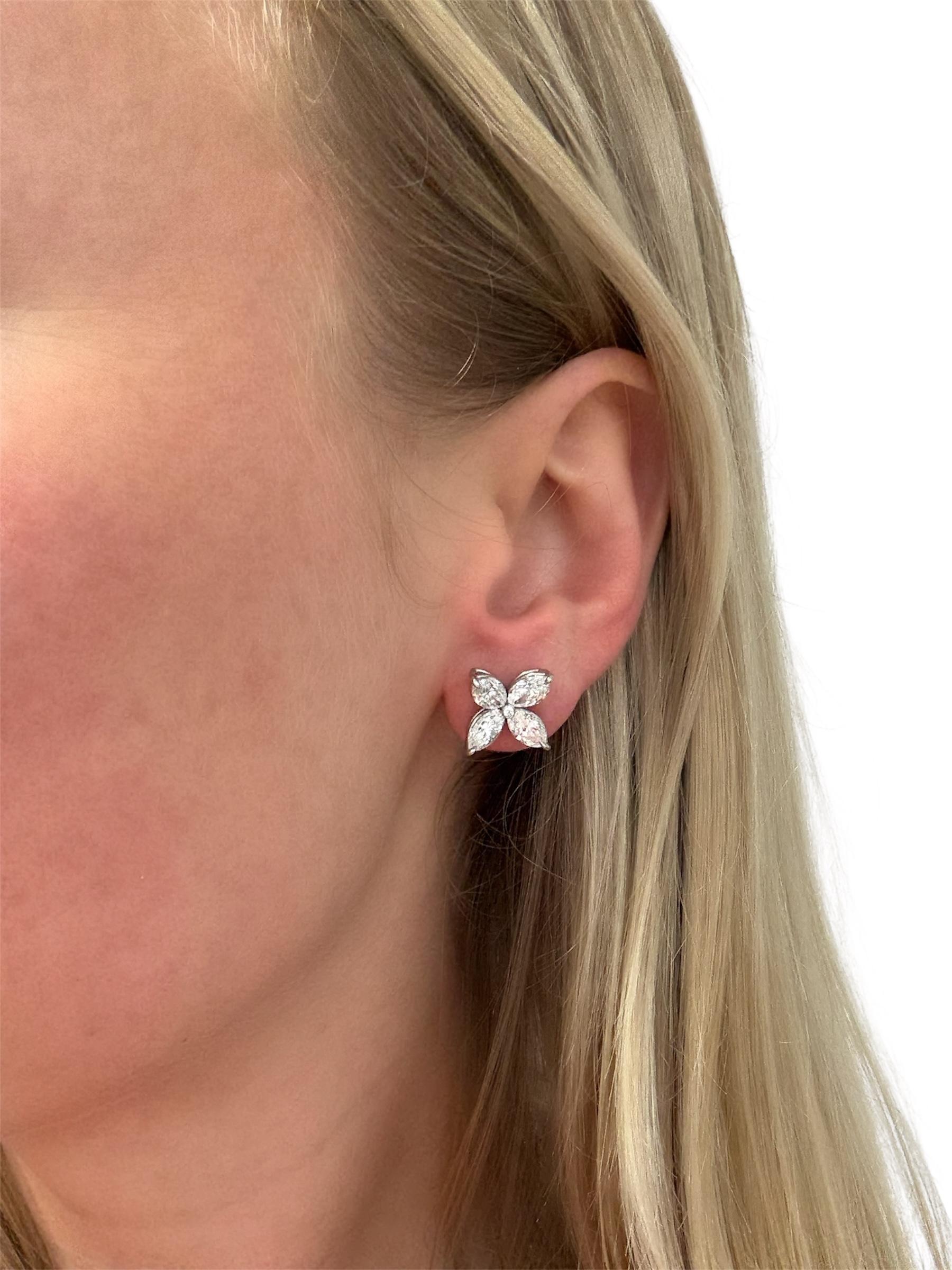 These classic sparkly four leaf flower earrings contain eight marquise cut diamonds weighing 5.00 carats total. The perfect earring for every collection.

Measurements: 5/8 inch
Gross weight: 5.50 grams

Diamond Characteristics (insofar as the