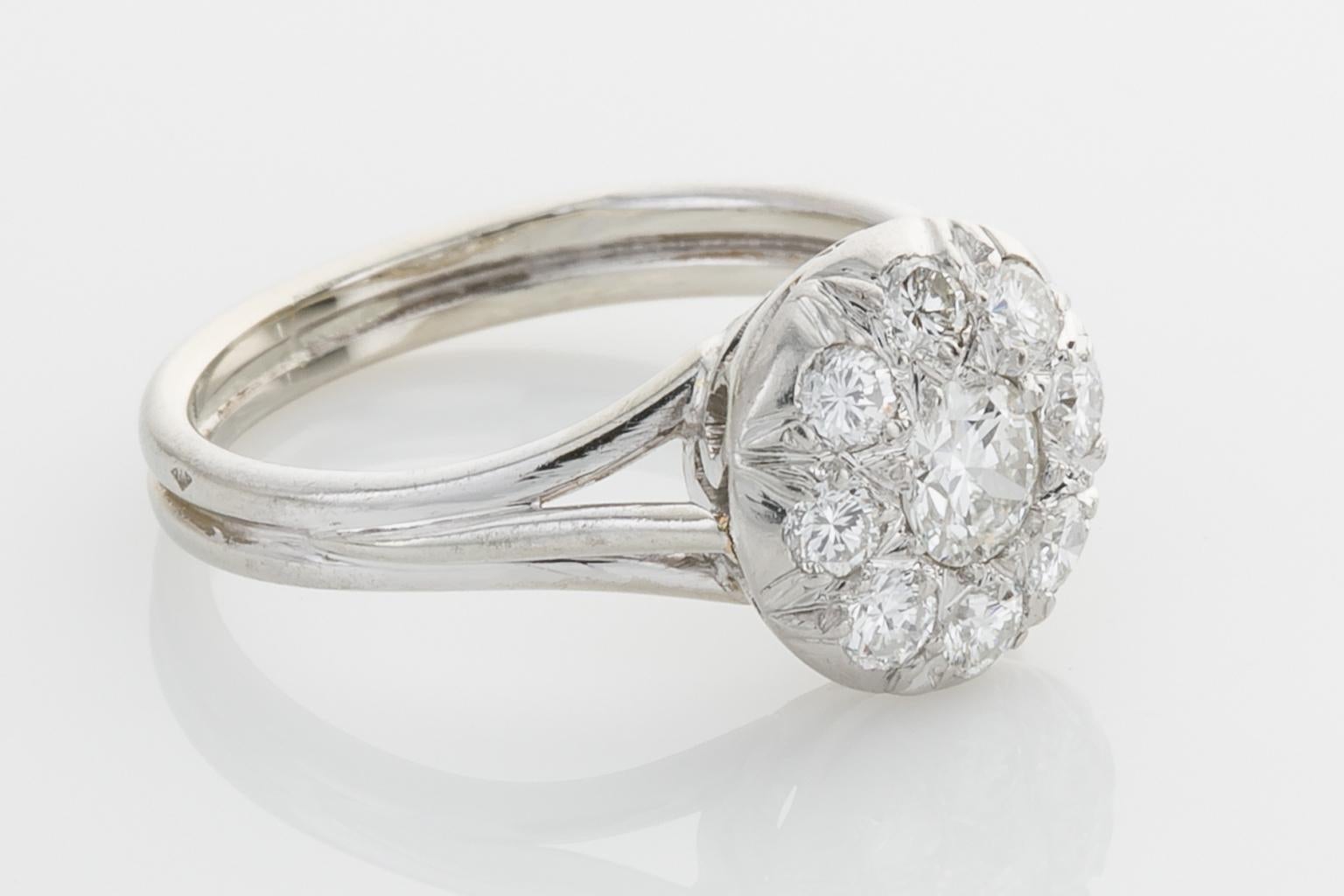 The perfect cluster ring - not too big and not too small, it's just right and it's French. Set with a central old cut diamond weighing approximately 0.28cts surrounded by 8 round cut diamonds weighing another 0.40cts (estimated), the ring is mounted