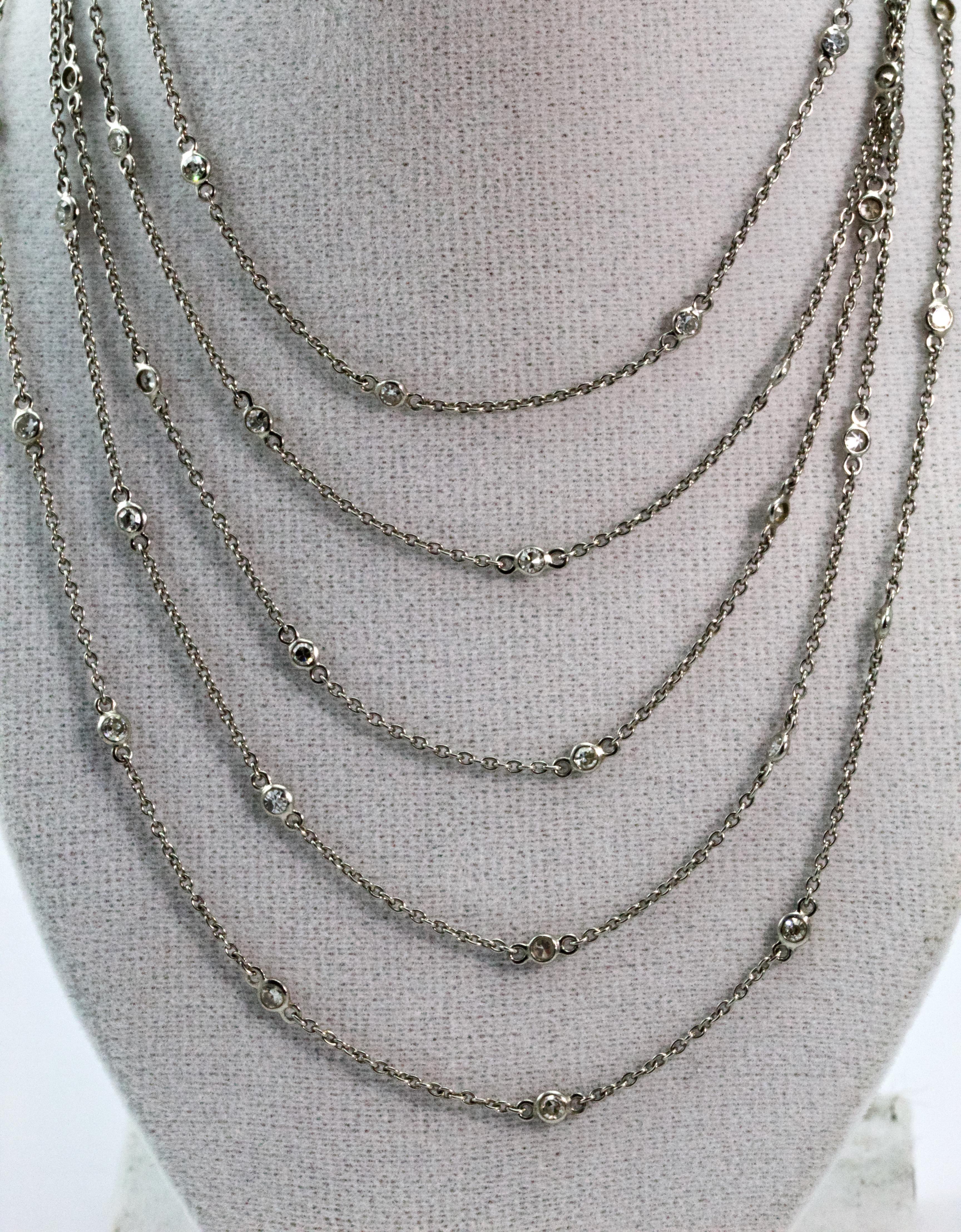 Fashioned circa 1920s this Art Deco long guard chain is comprised of platinum cable style links to give a chain of approximately 50 inches long. Beautifully embellished with 50 Old European cut diamonds spaced around an inch apart.  A lovely antique