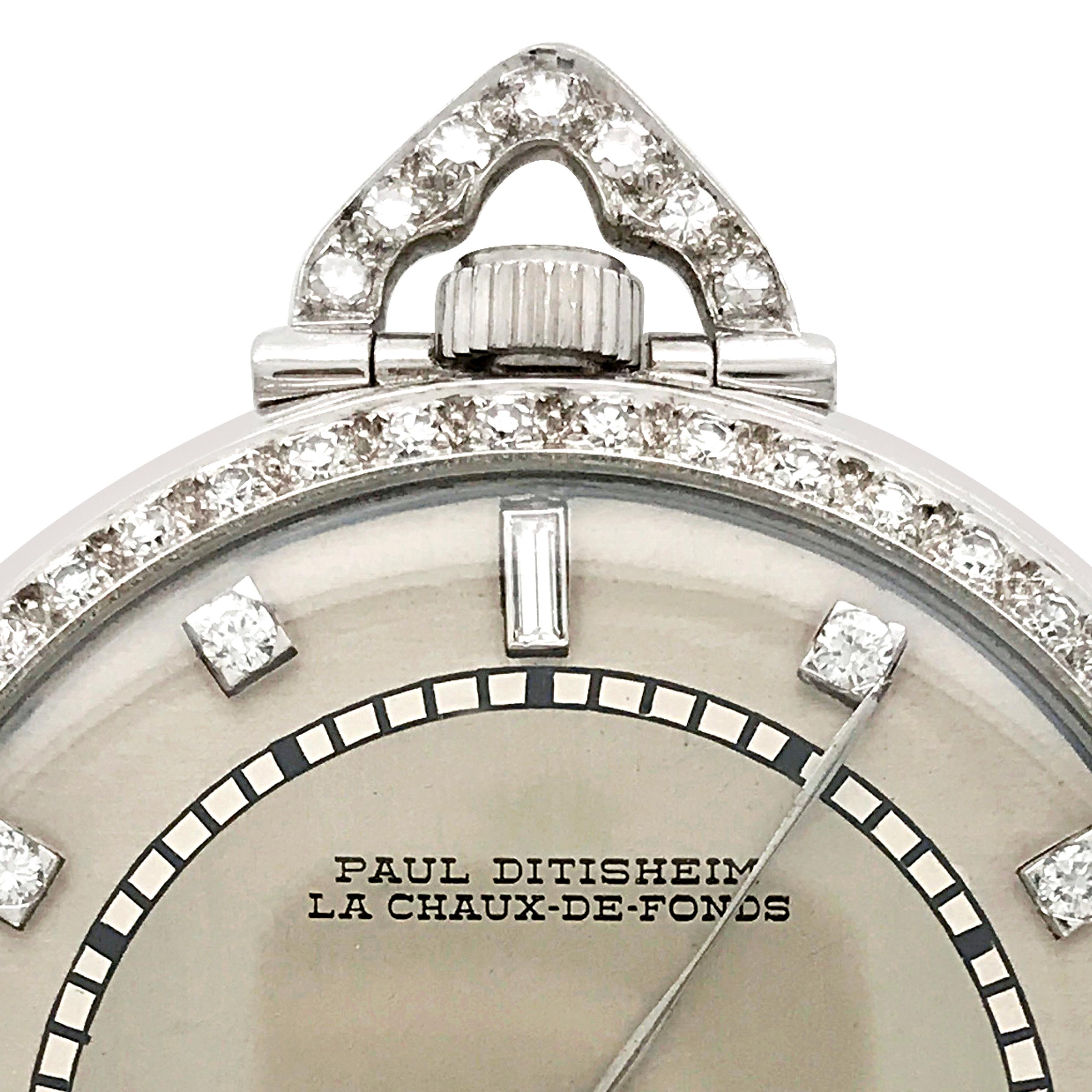 This vintage diamond open face pocket watch is rendered in platinum, weighs 62.11 grams and measures 44mm in diameter. Set within a diamond-set bezel and bow, the circular brushed and matte silver-tone dial applies round and baguette diamond