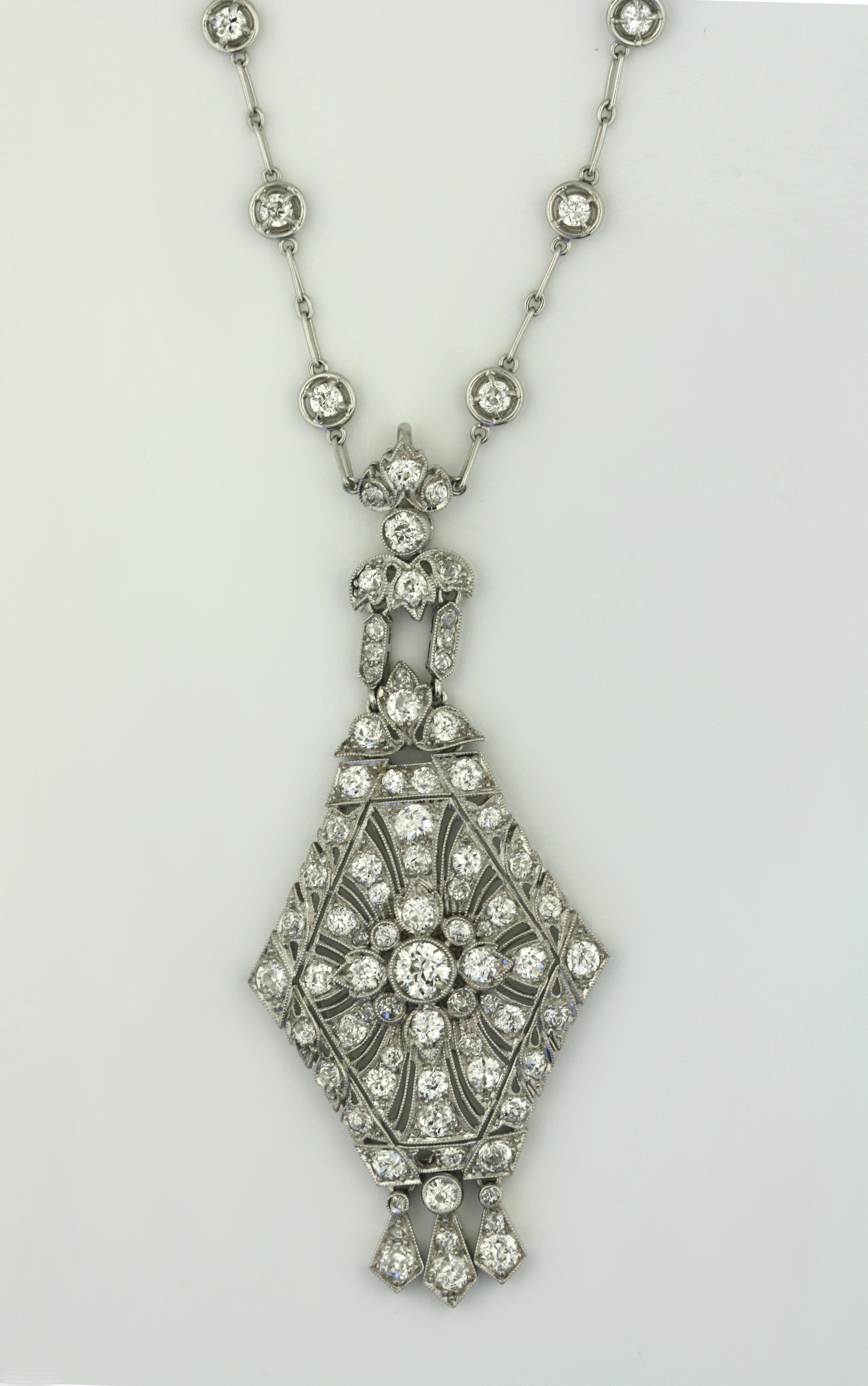 
Platinum and Diamond Pendant Necklace
The kite-shaped pendant of openwork design, centering a round white diamond weighing approximately 3/8 carats, accented by numerous round accent diamonds.
suspended from a chain set at intervals with 26 round