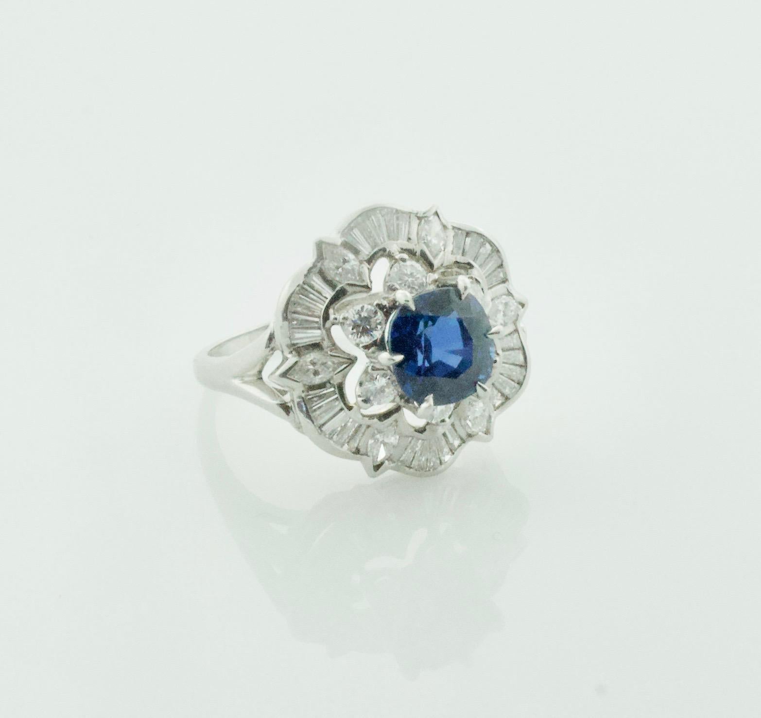 Platinum and Diamond Stylized Ballerina Ring Circa 1940's 
One Cushion Cut Sapphire Weighing 2.62 Carats [bright with no imperfections visible to the naked eye]
Six Marquise Cut Diamonds Weighing .30 Carats Approximately 
Thirty Tapered Baguette 