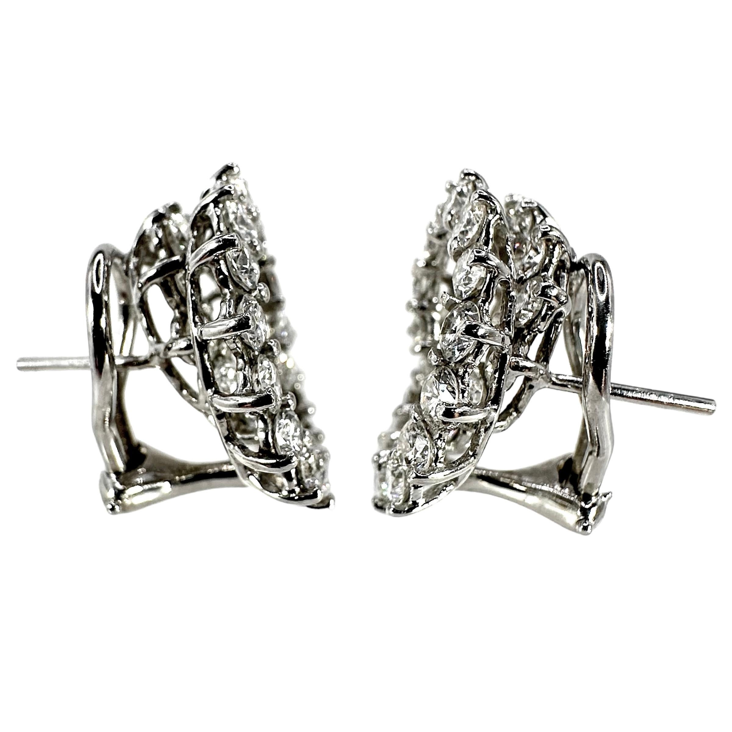 This  iconic vintage pair of platinum and diamond earrings were conceived by noted jewelry designer Angela Cummings, on behalf of Tiffany and Company. The exciting design is now retired but their ingenious style will always create a true sense of