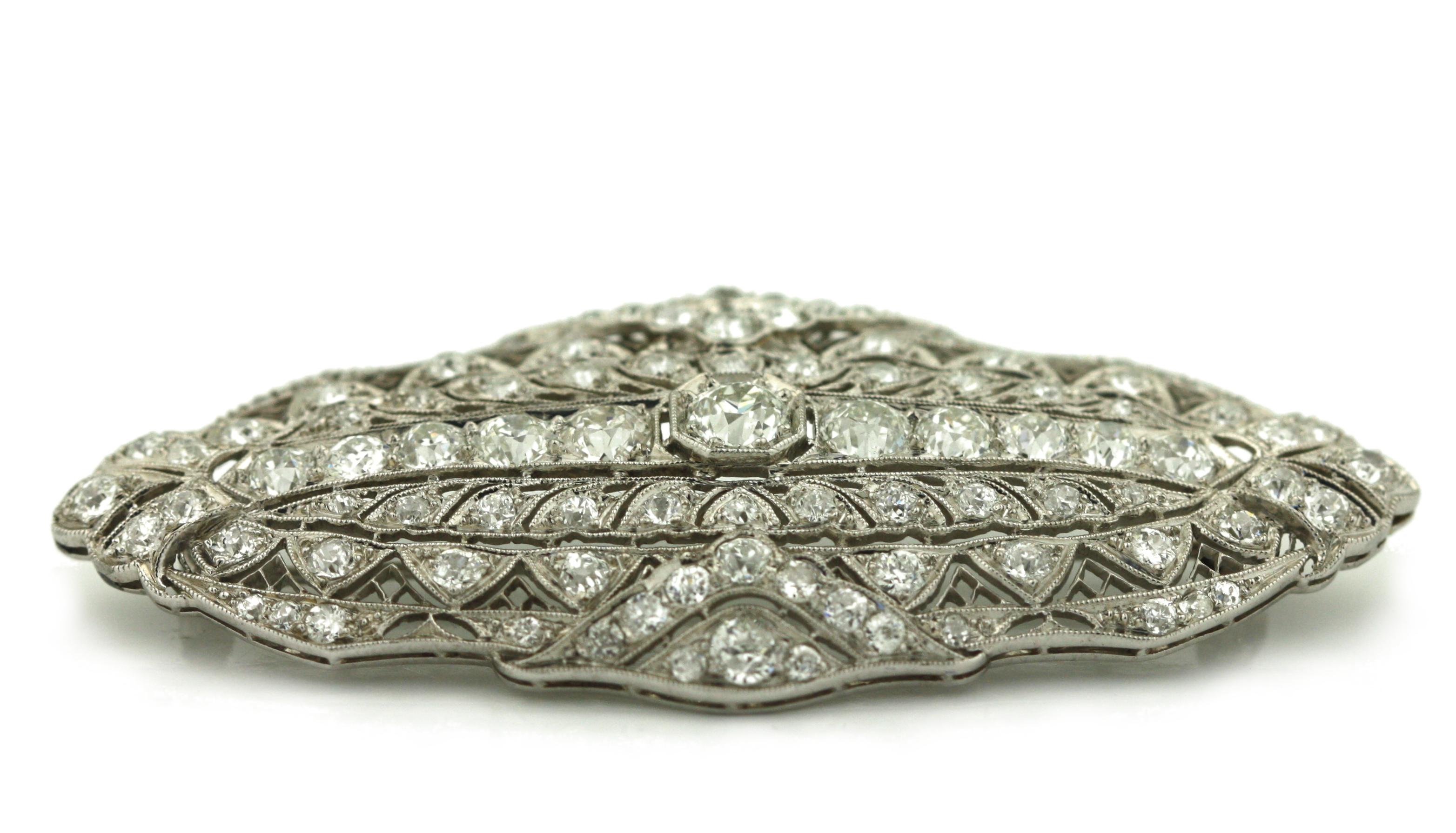 
Platinum and Diamond Vintage Brooch
Composed of transitional and single-cut diamonds.
Center diamond weighing approximately .65 carats
Additional diamonds weighing a total of approximately 3.55 carats
Platinum
Total weight 14.06 grams
Length 2 1/2