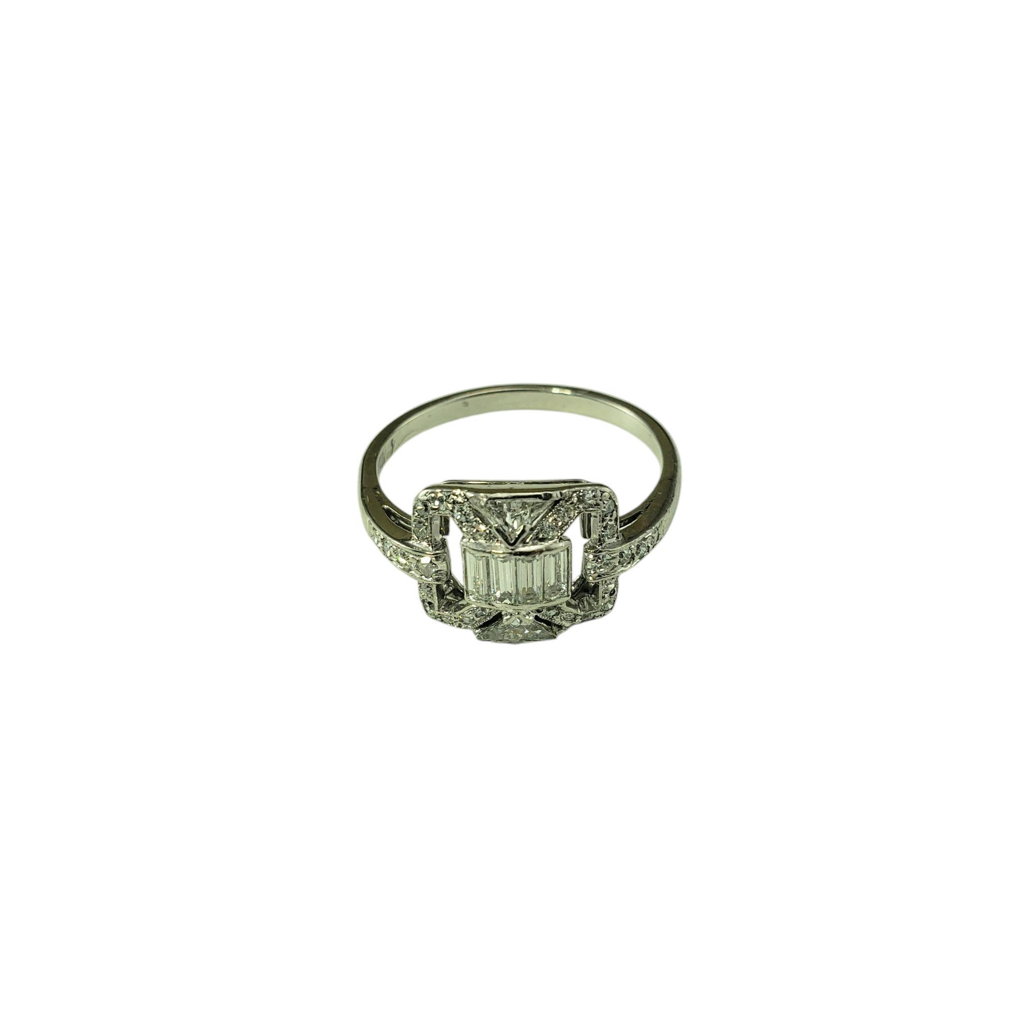 Platinum and Diamond Vintage Style Ring Size 6.5 JAGi Certified-

This sparkling ring is decorated with four baguette cut diamonds, two triangle cut diamonds and 28 round single cut diamonds set in classic platinum. The negative space design