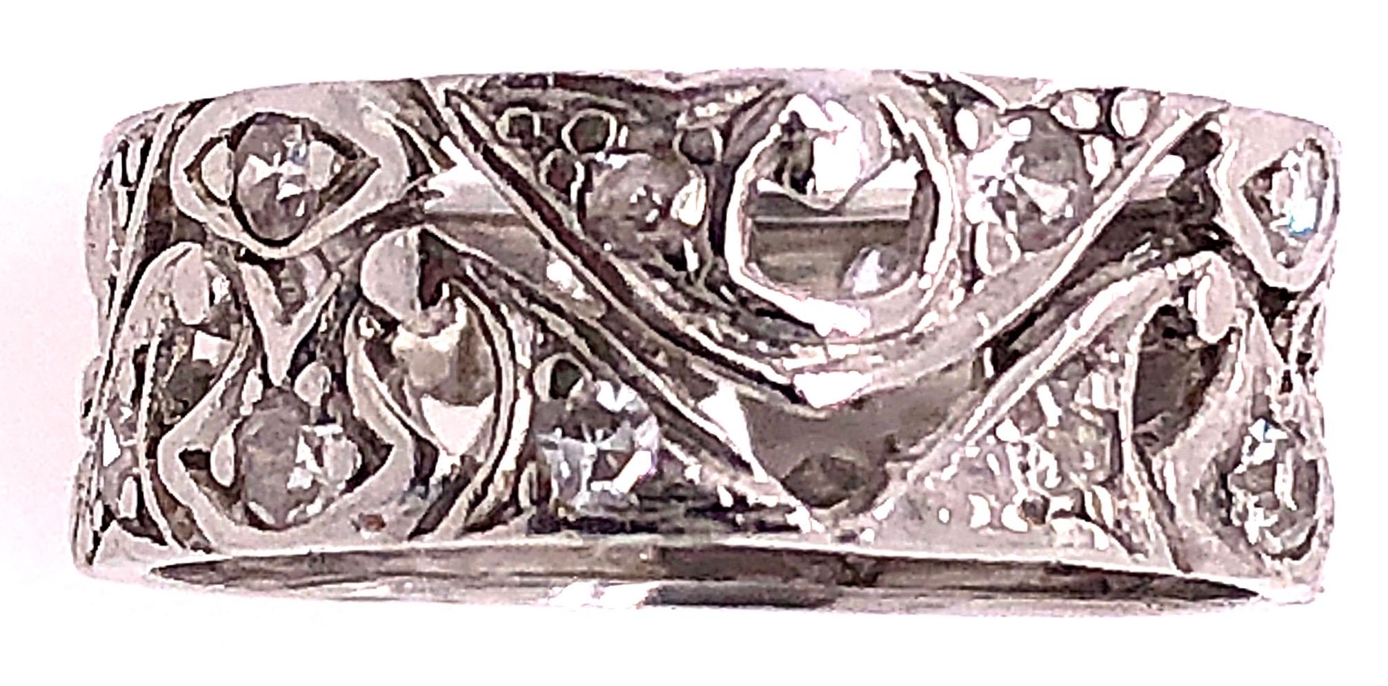 Platinum And Diamond Wedding Band / Bridal Ring Filigree Design
22 piece round diamonds with 0.50 total diamond weight.
Size 5.25
4.20 grams total weight.
7 mm wide.

*This ring can be resized at your local jeweler.