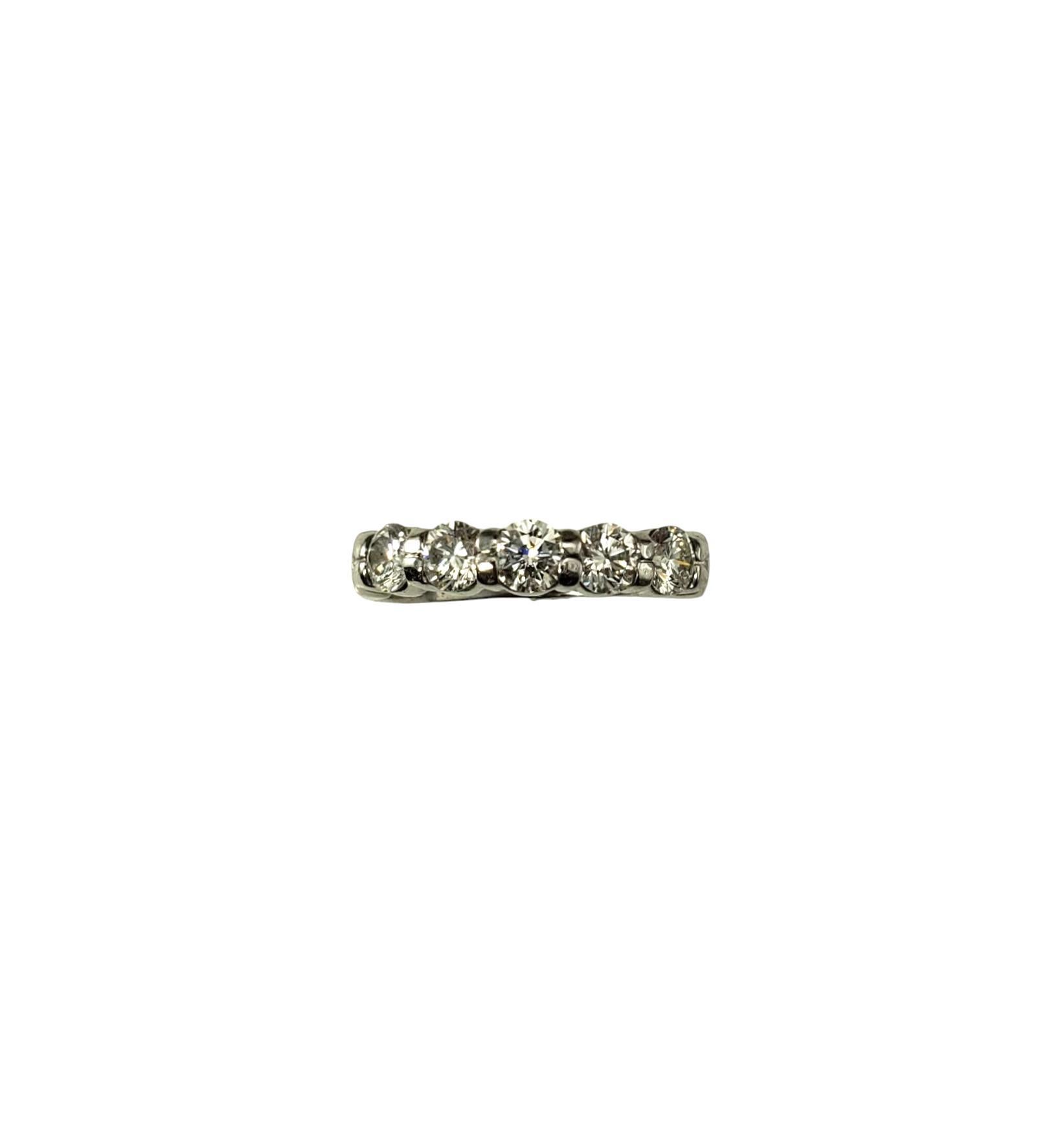 Platinum and Diamond Wedding Band Ring Size 6.25

This sparkling ring features five round brilliant cut diamonds set in classic platinum.

Width: 4 mm. Shank: 3 mm.

Front of ring is approx. 19mm x 4mm x 3mm

Approximate total diamond weight: 1.05