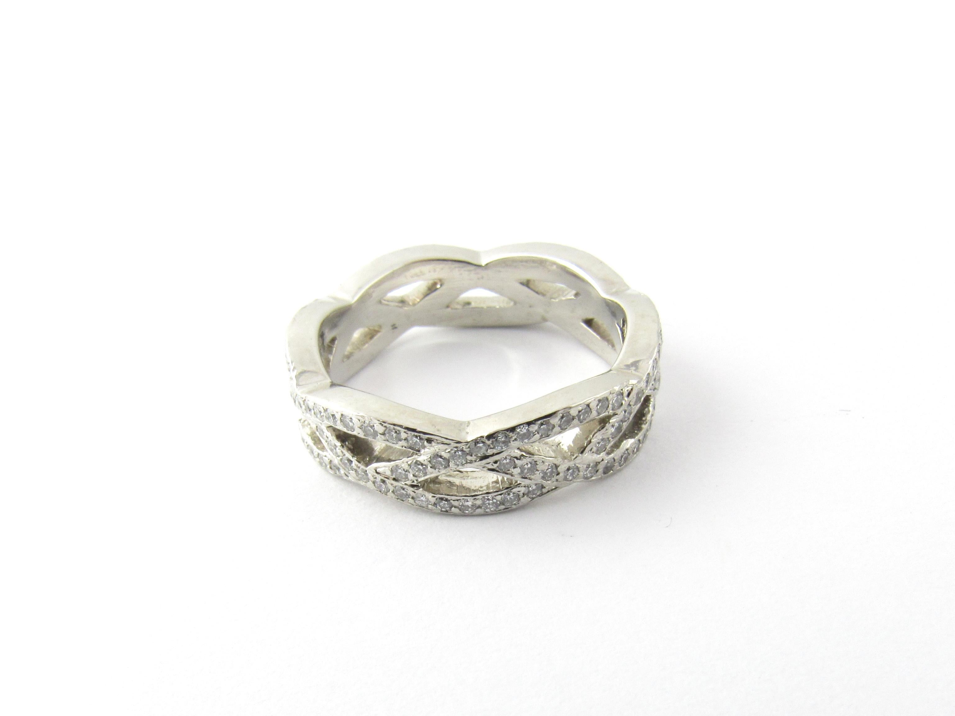 Platinum and Diamond Wedding Band Size 6.25-

This sparkling eternity band features 132 round brilliant cut diamonds* set in a stunning braided design.  Width measures 5 mm.

*Chips noted to some not visible to naked eye

Approximate total diamond