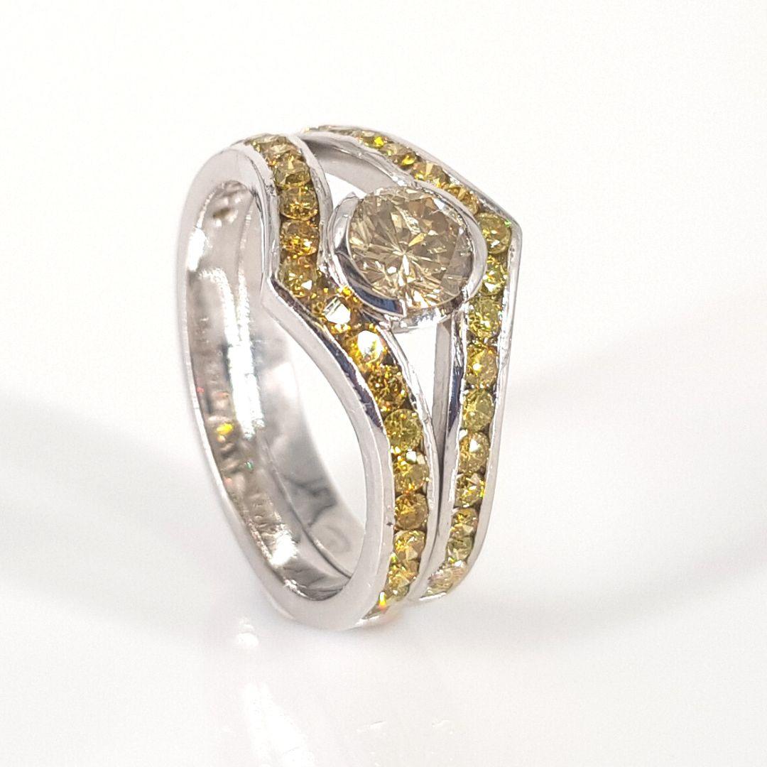 Unique

Item Attributes:

Metal Colour:                White and yellow

Weight:                           9.2g         

Size:                                 P

Center Stone Attributes

Number of Stones:        1 Fancy yellow Diamond

Cut:       