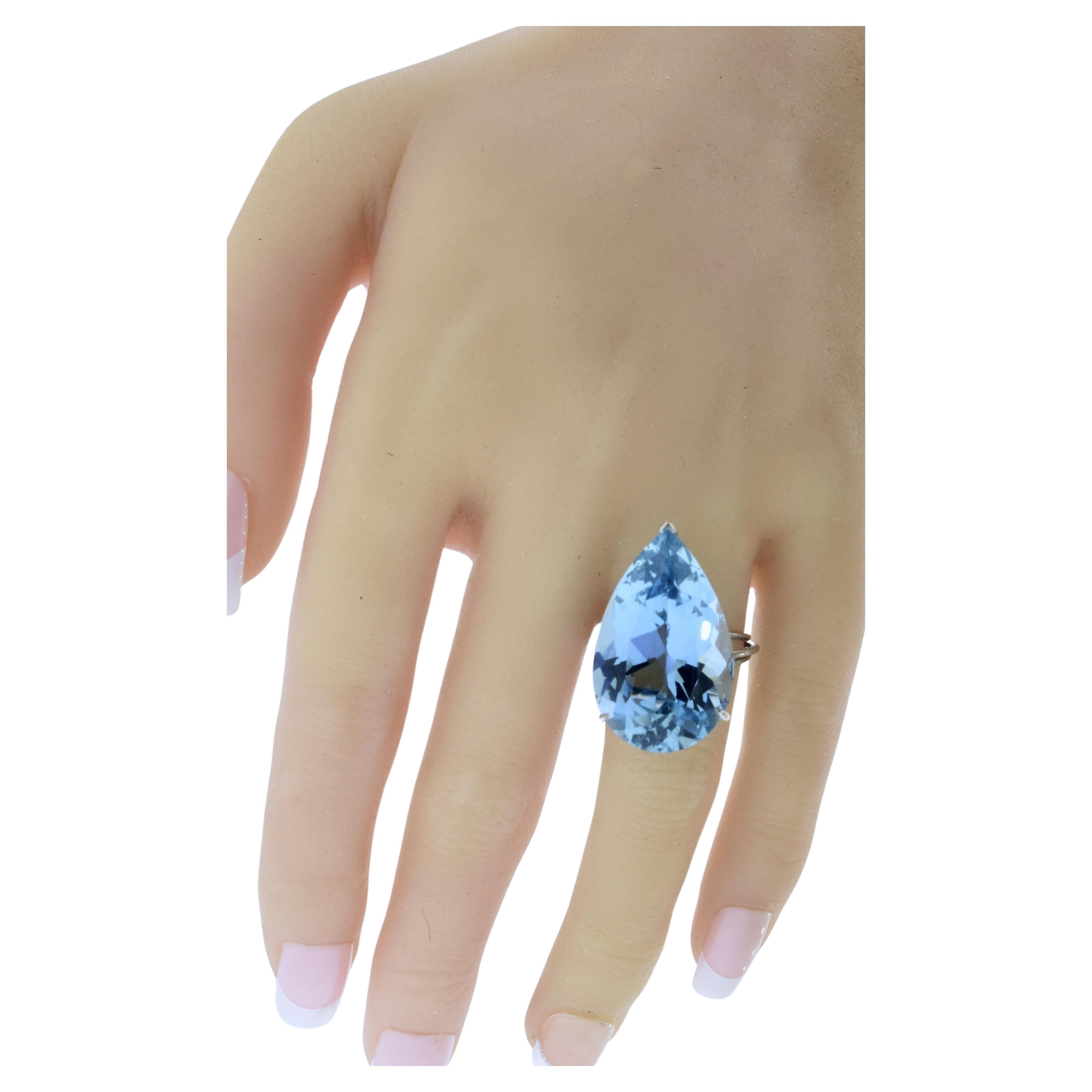 The fine large natural Aquamarine is probably from the Brazilian Santa Maria mines as evident of the stone's fine color, (without green undertones) and clarity. The bright stone is prong set in a fine hand-crafted platinum setting.  
,
This ring is