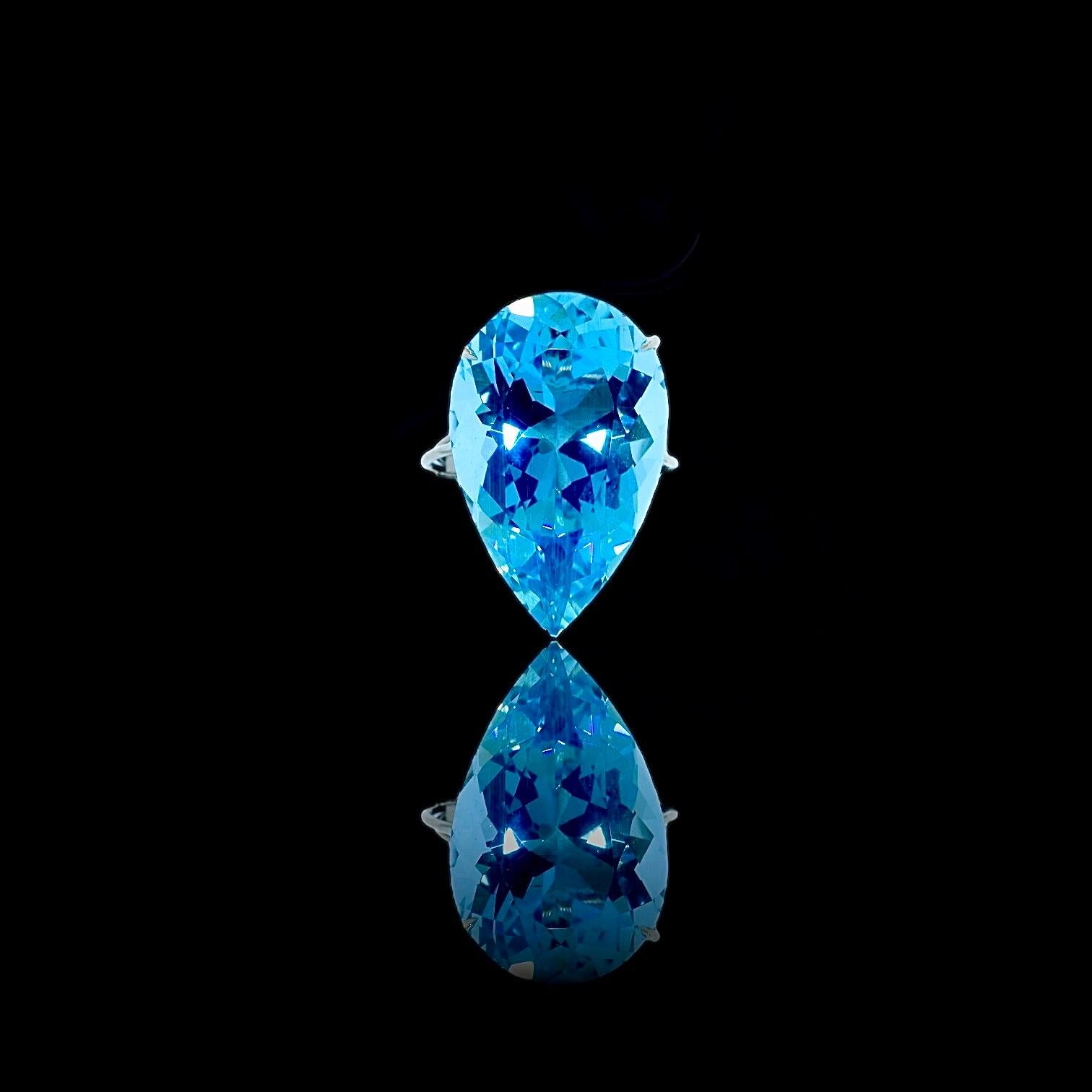 The fine large natural Aquamarine is probably from the Brazilian Santa Maria mines as evident of the stone's fine color, (without green undertones) and clarity. The bright stone is prong set in a fine hand-crafted platinum setting.  
,
This ring is